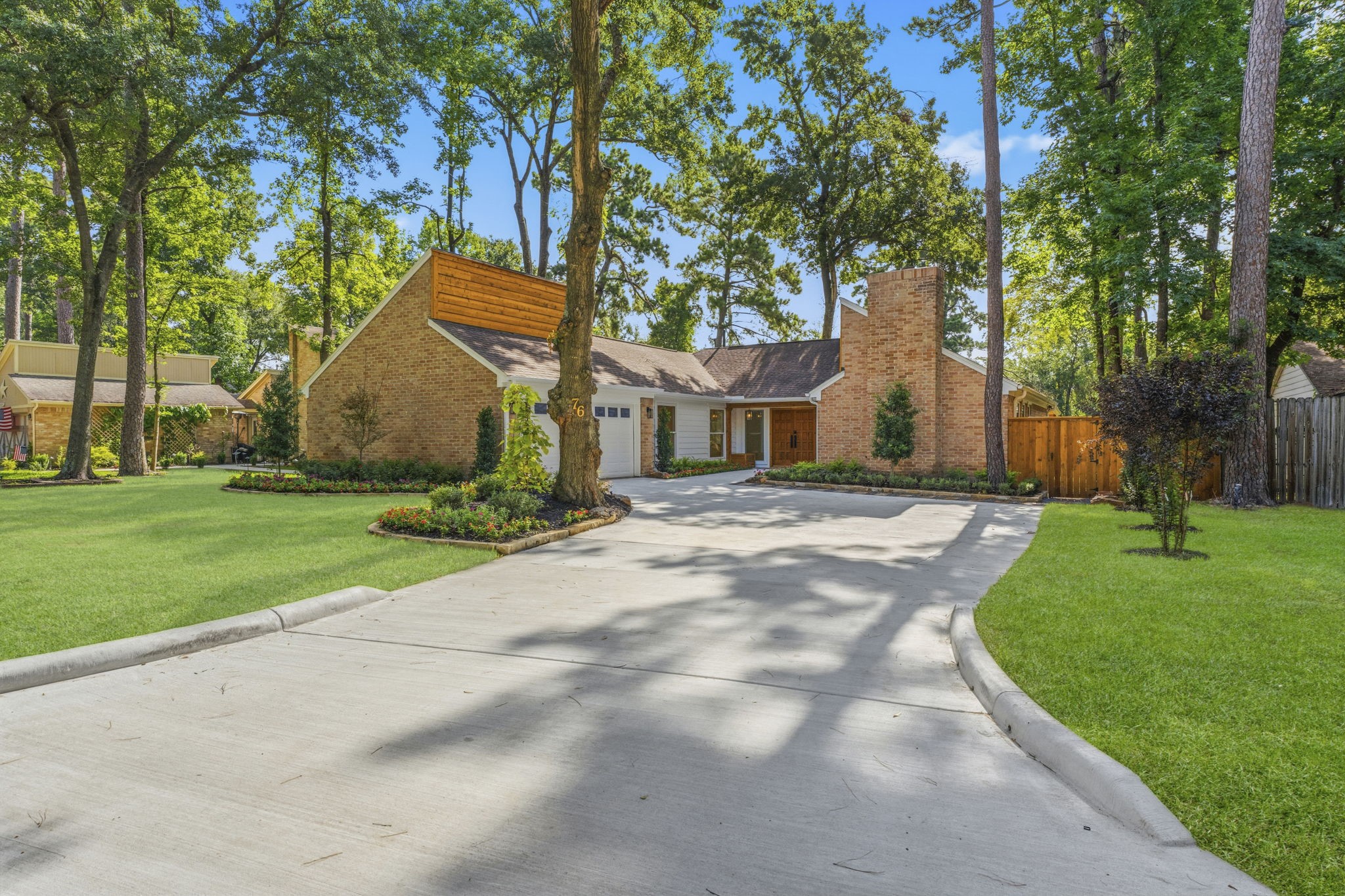 Welcome home to this beautifully reimagined residence nestled beneath mature trees in the highly desirable front of The Woodlands.
