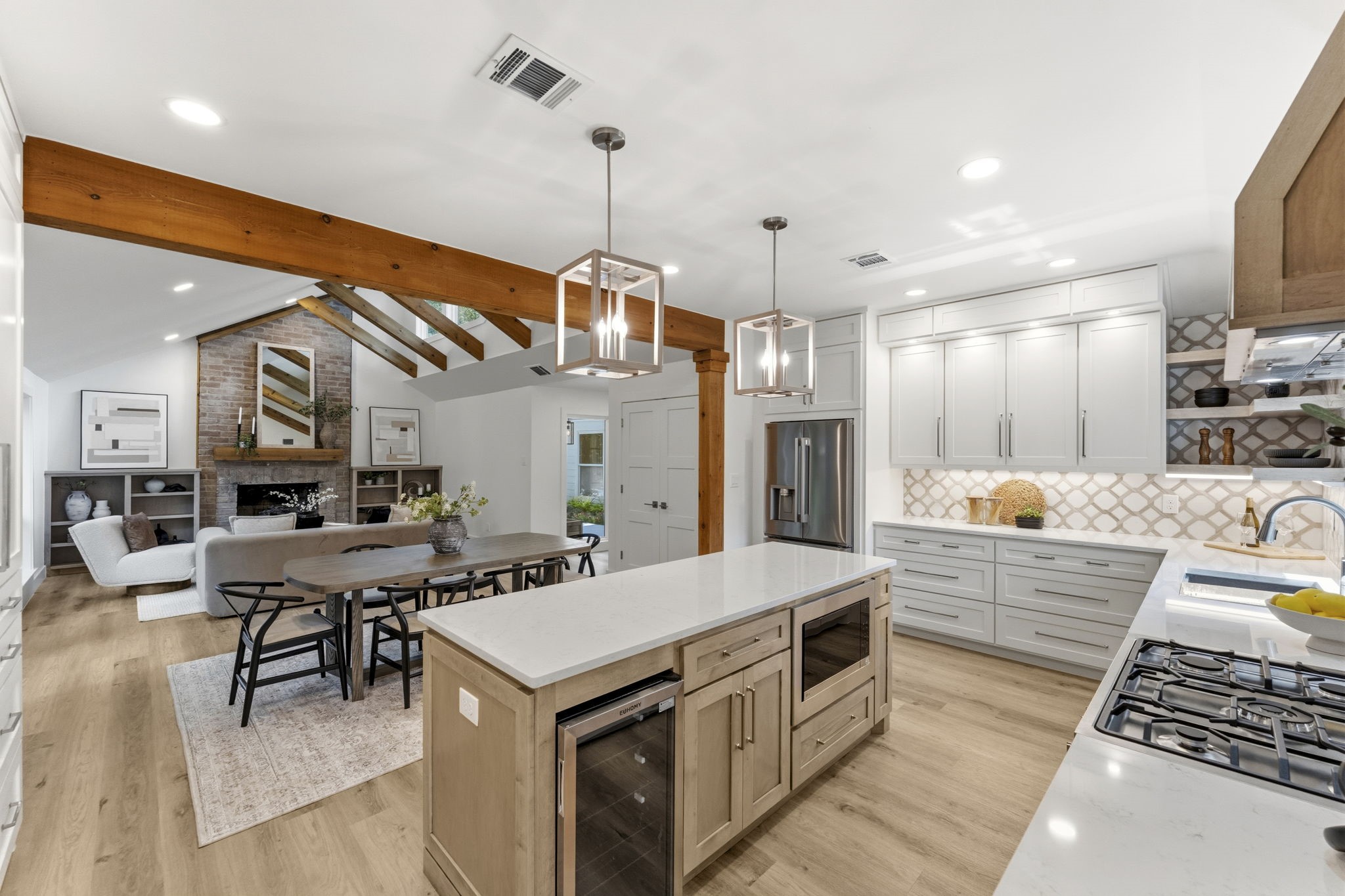 Premium stainless steel appliances and an open connection to the dining and living areas make this space as functional as it is beautiful.