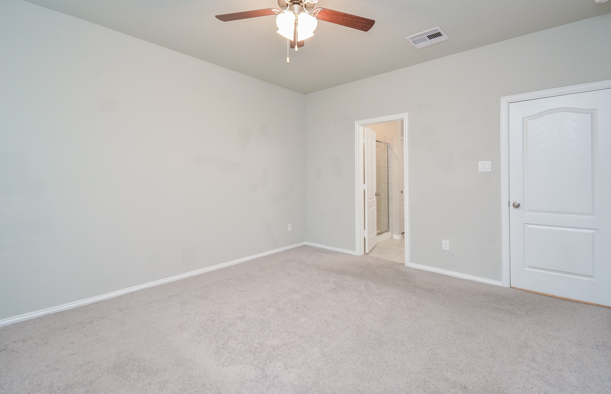 This soothing place is your carpeted primary ensuite bedroom/bath.