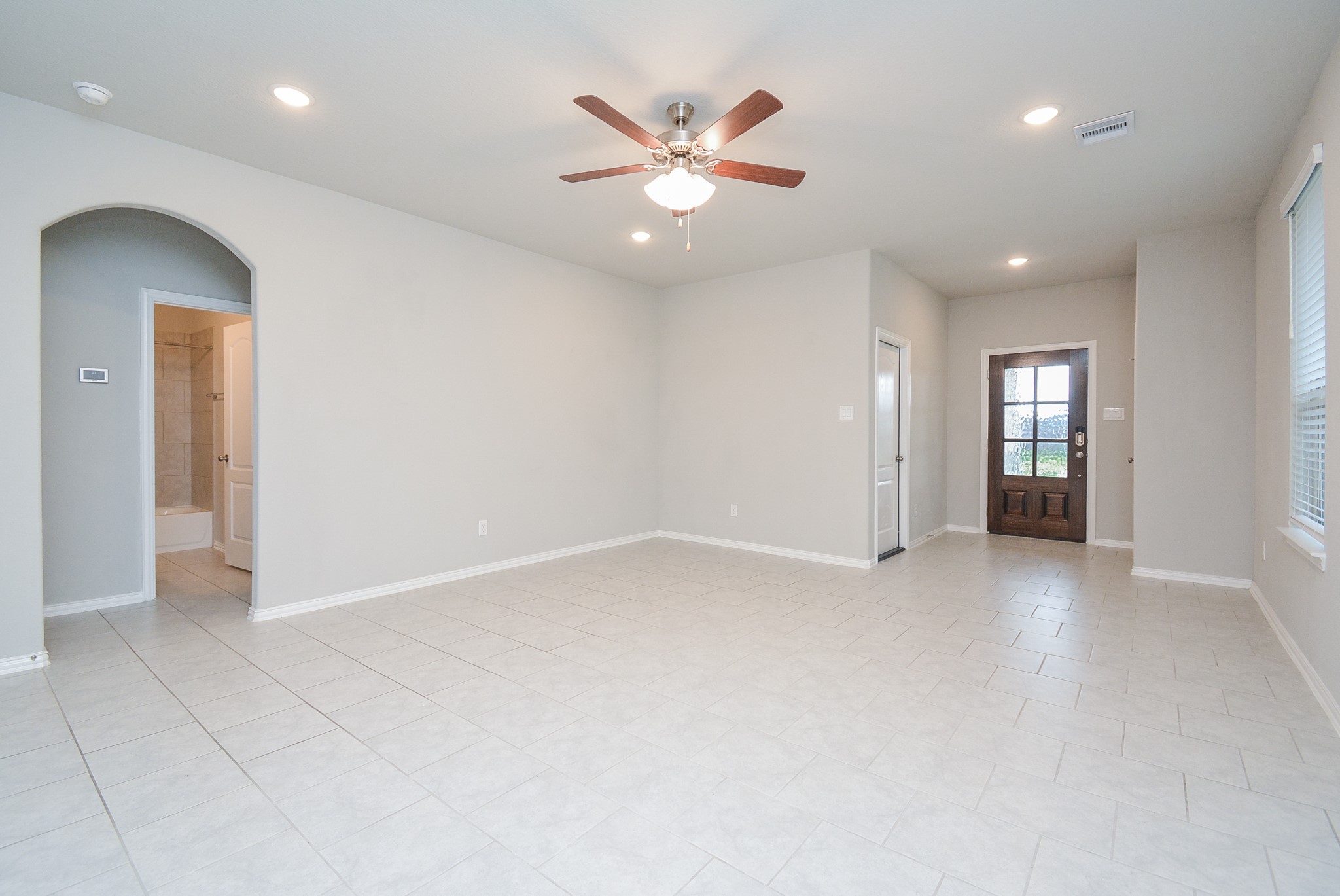 This is the enormous living/family area, with a high ceiling and room galore for your favorite pieces.