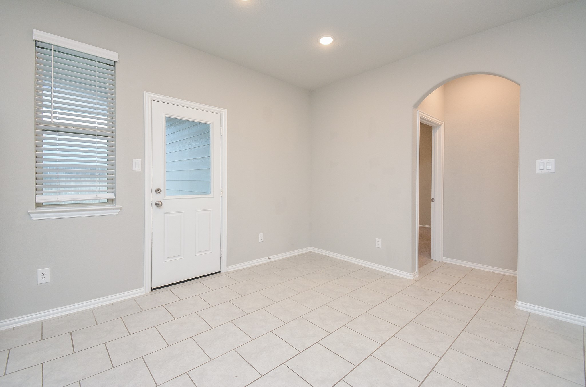 A nice window and clear glass paned patio door bring added natural light into the space. Here's a better look at what can become a breakfast nook corner.