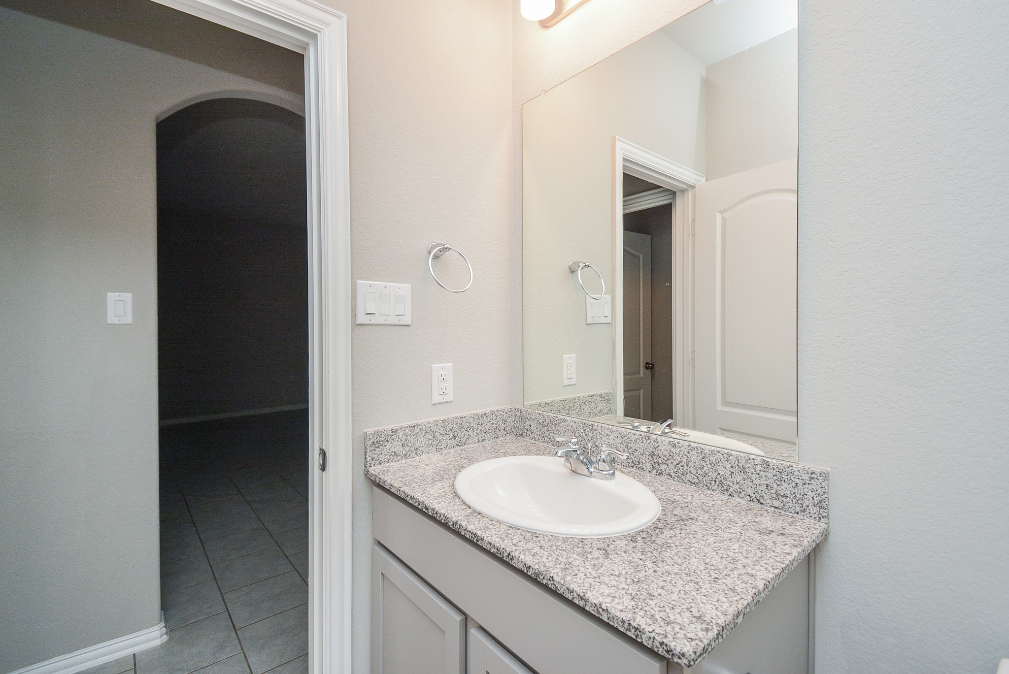 The second bathroom sits off the main living area, left.