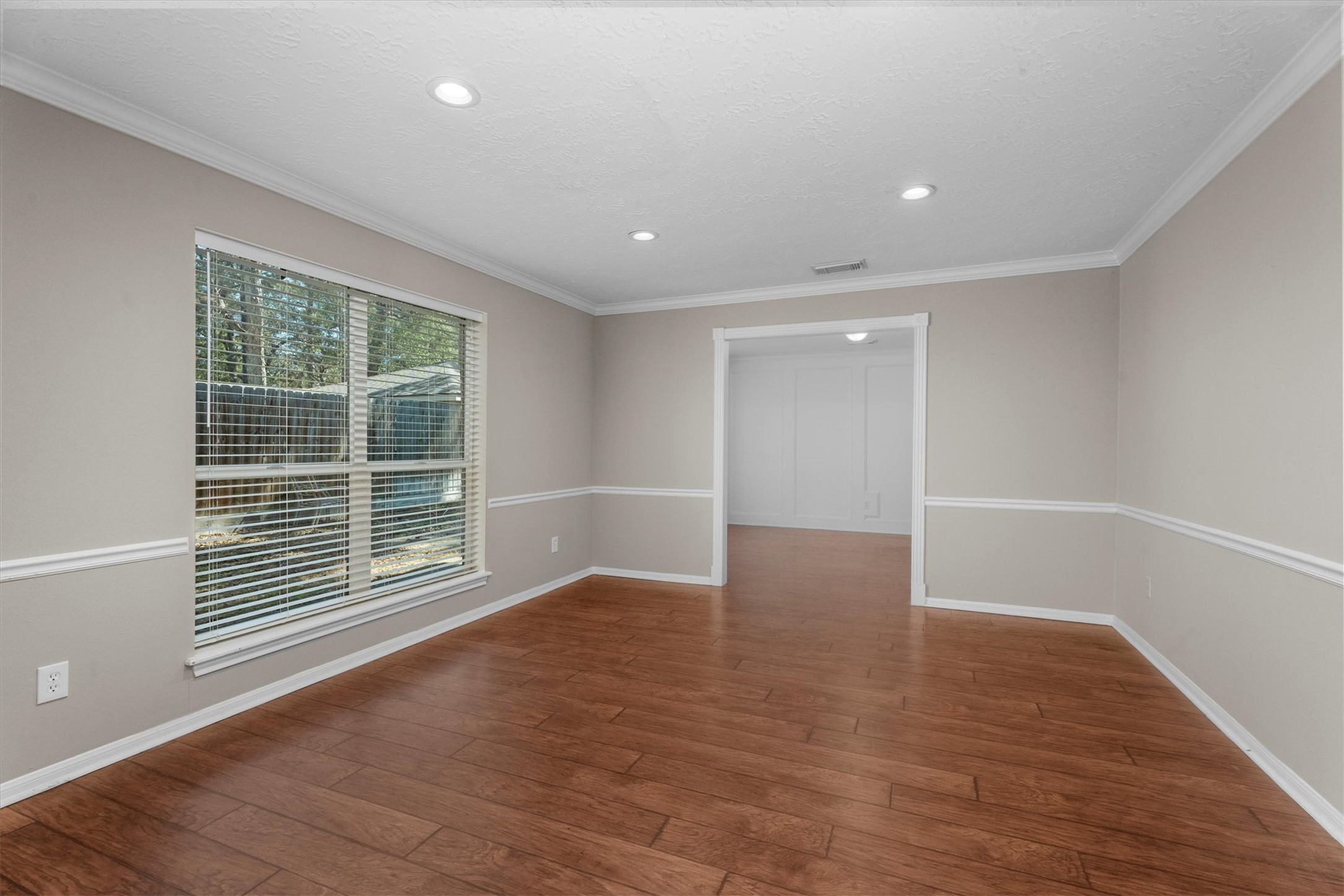 light filled Living Room opening to Dining Room