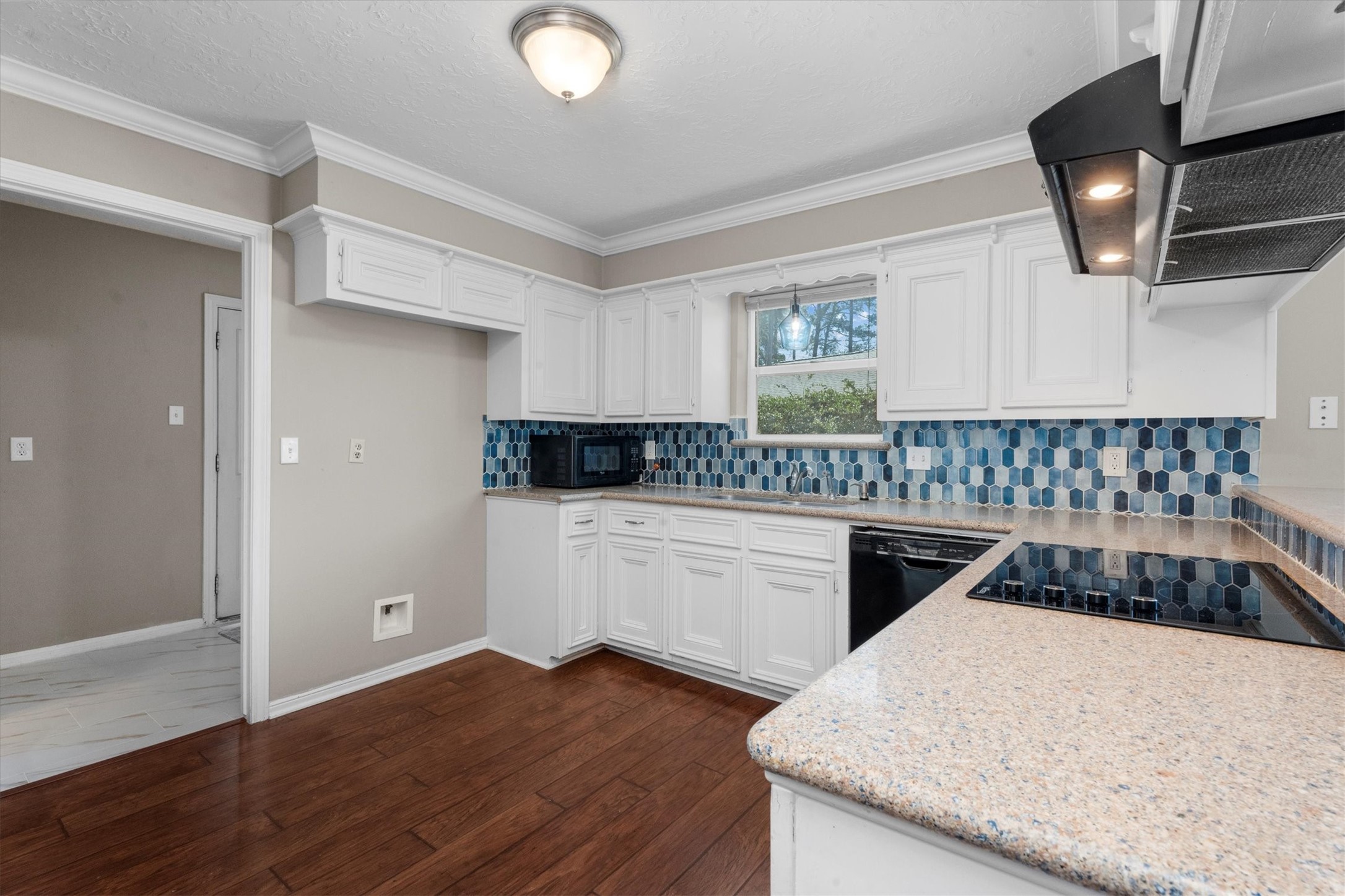 Kitchen you have been waiting for!! White Kitchen Cabinets, updated back splash , Brand new Glass Cooktop ,Granite Counters, Pots and Pans Drawers