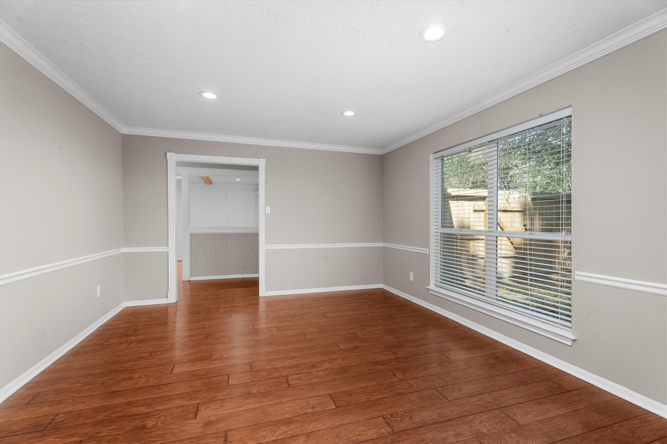 Living Room with chair rail, crown molding and updated flooring