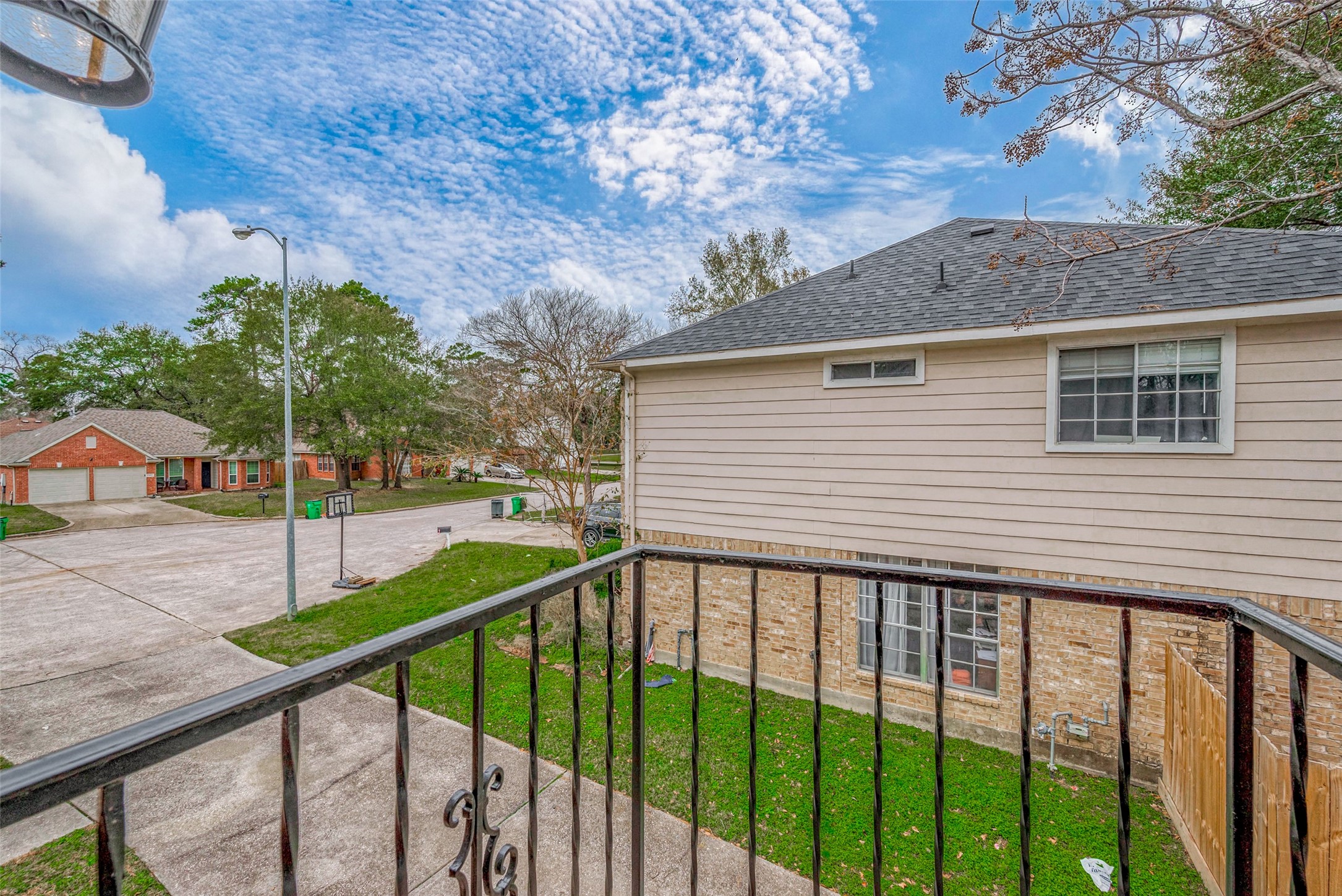 The balcony offers an elevated view of the surroundings, with a vantage point that overlooks the front yard and peaceful cul-de-sac. Its an ideal spot to enjoy the outdoors from the privacy of your home.