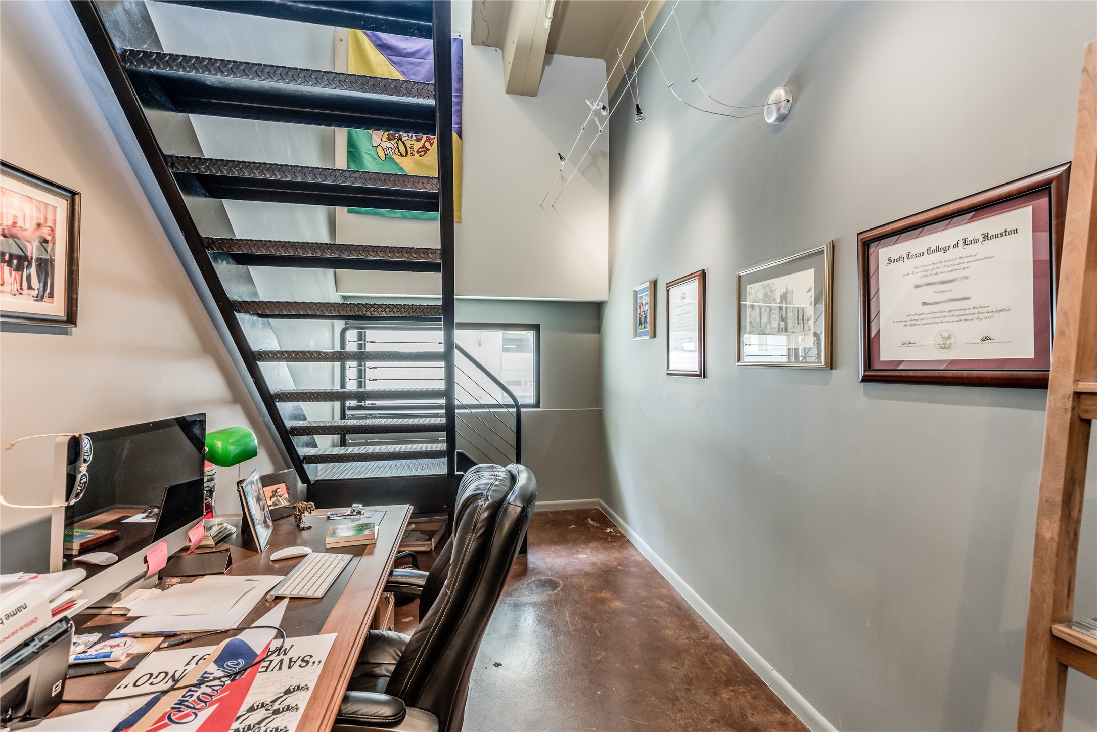 This photo showcases a modern condo nook office space with an industrial vibe.