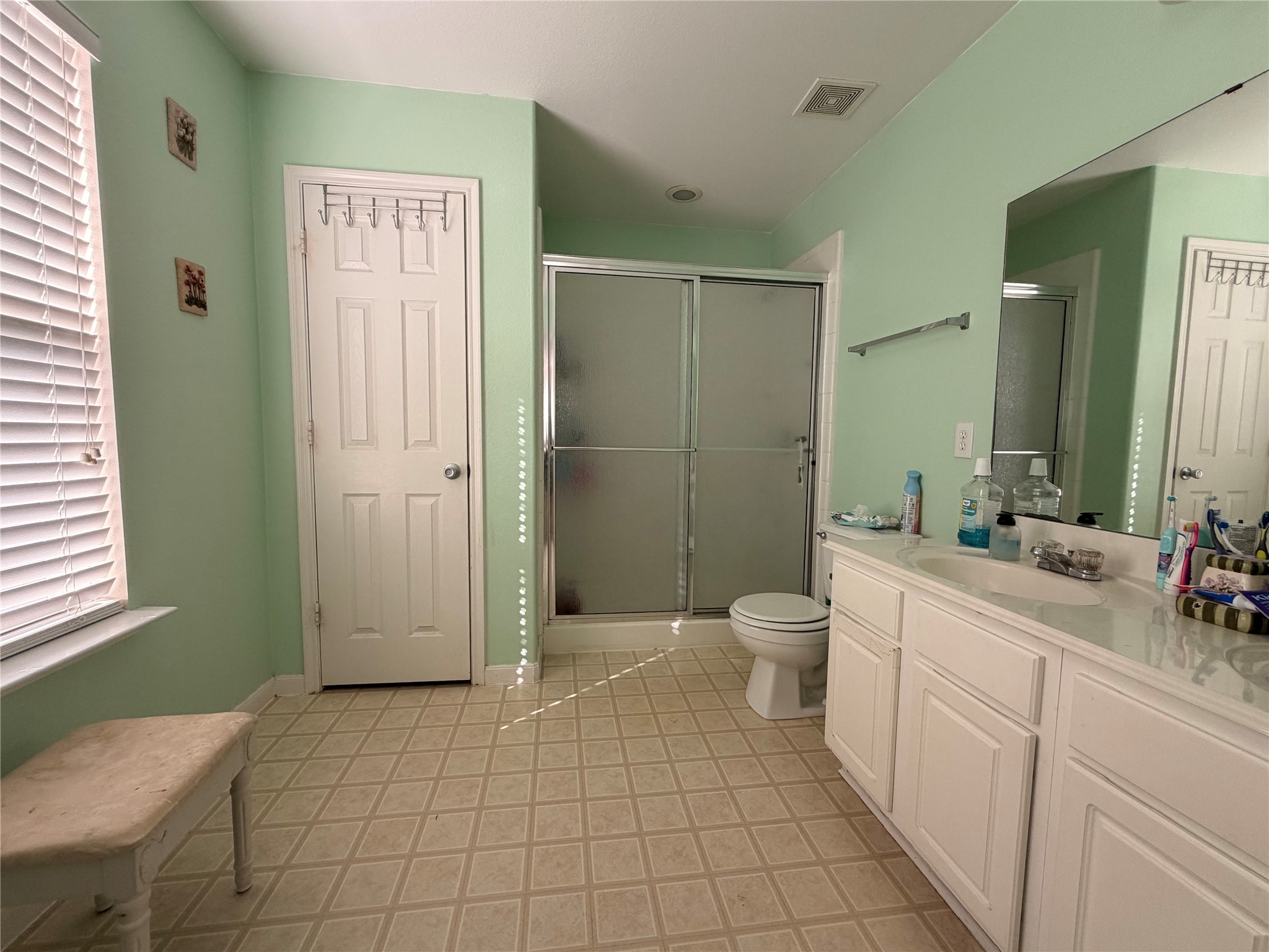 Primary ensuite bathroom with double vanity