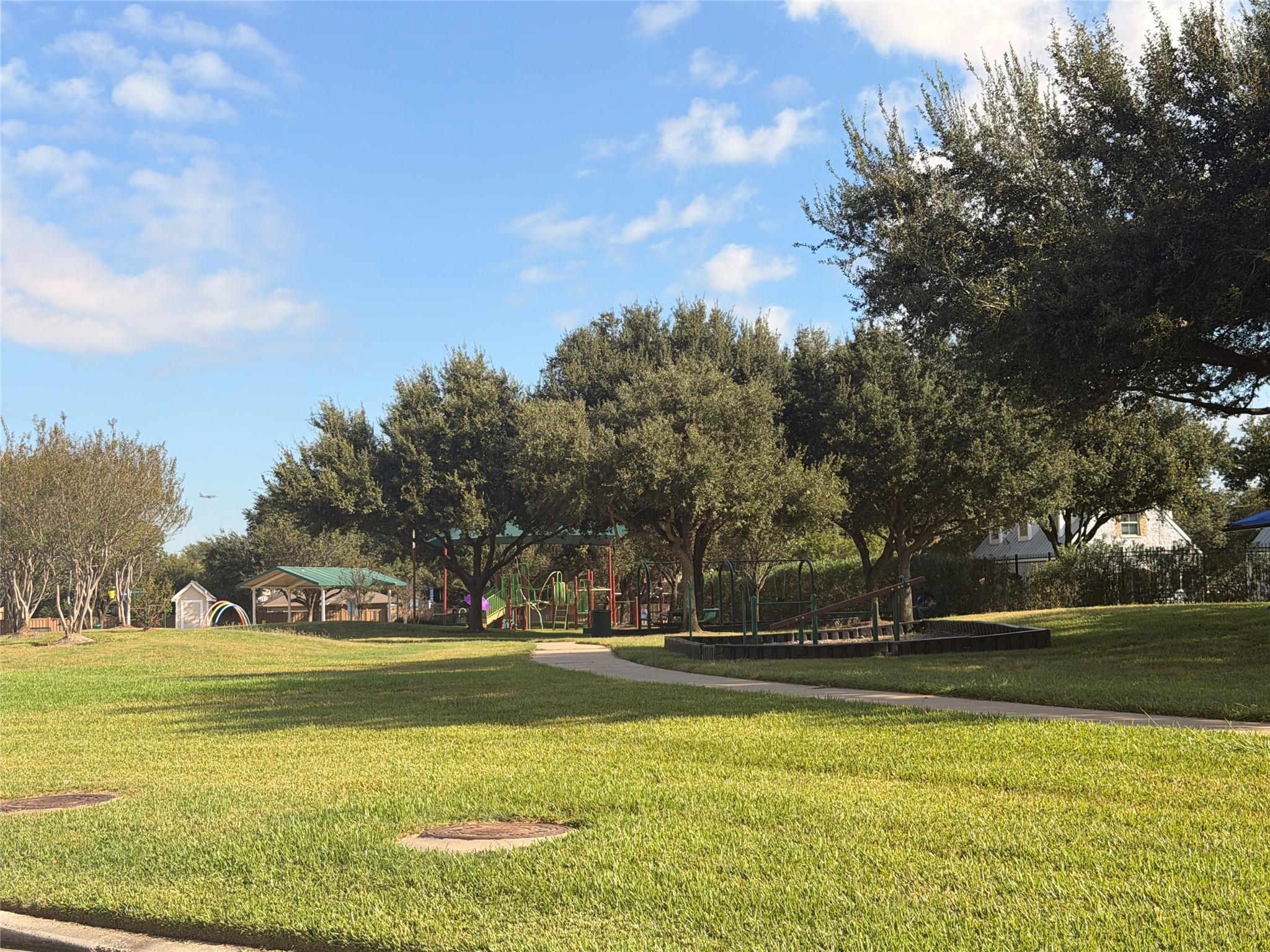 Park, playground and splash pad right in front of home