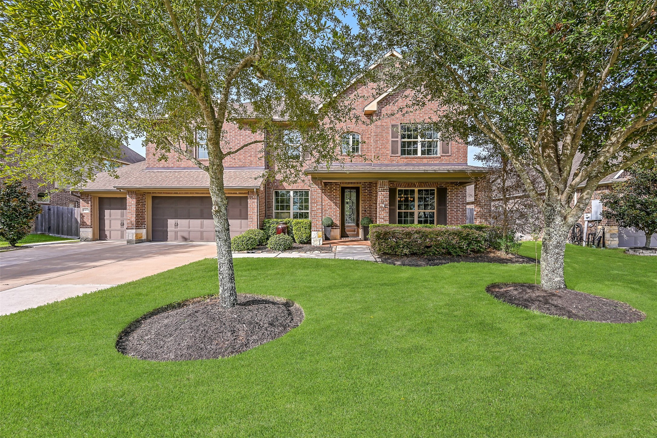 Beautifully maintained in the gated Arbor Gate at West Ranch community, this impressive 5-bedroom home offers approx. 4,078 SF with a traditional brick exterior, mature oak trees, manicured landscaping, covered front porch & 3-car garage.