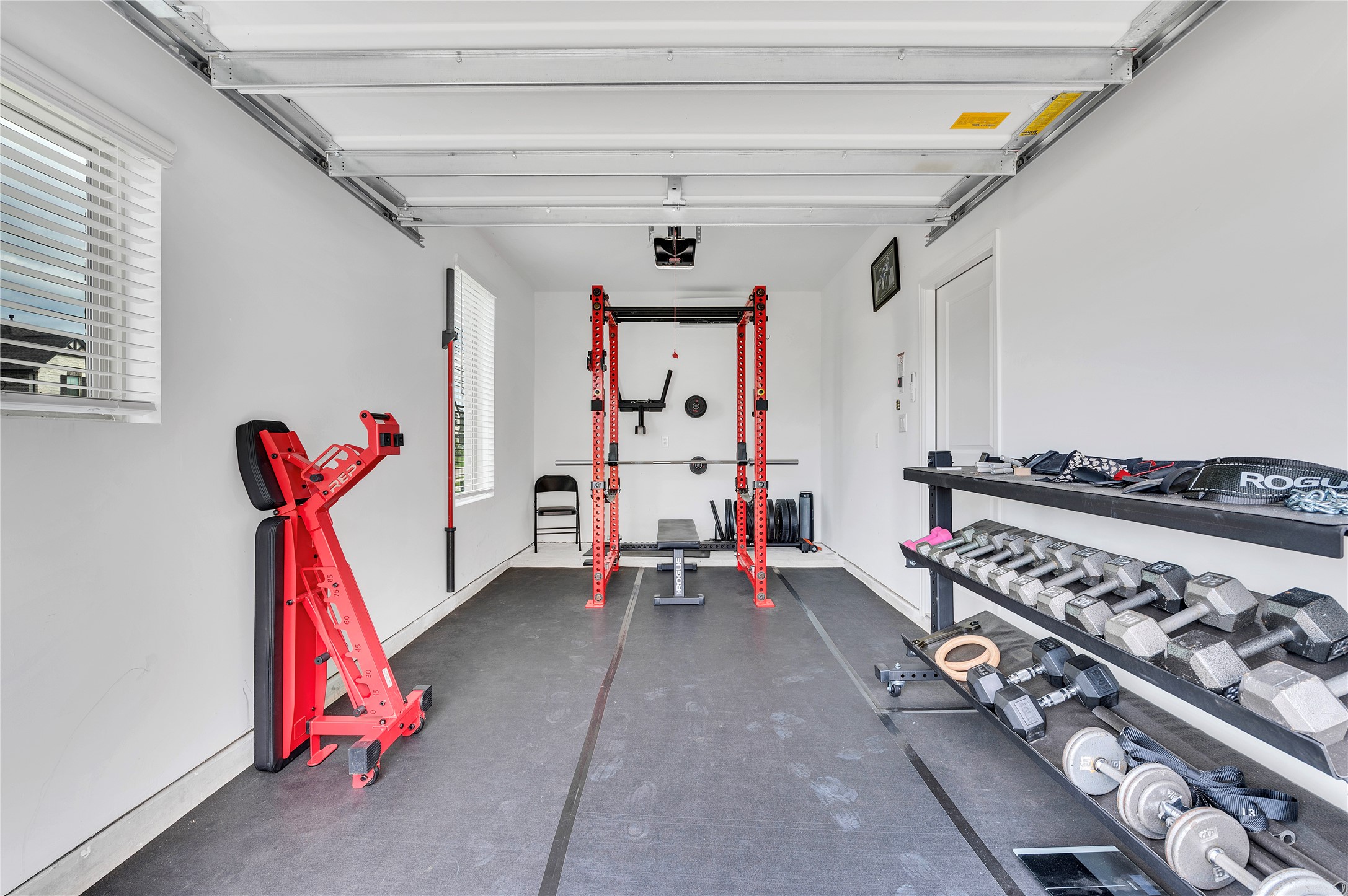 AIR CONDITIONED single garage perfect for home gym! Double garage not pictured!