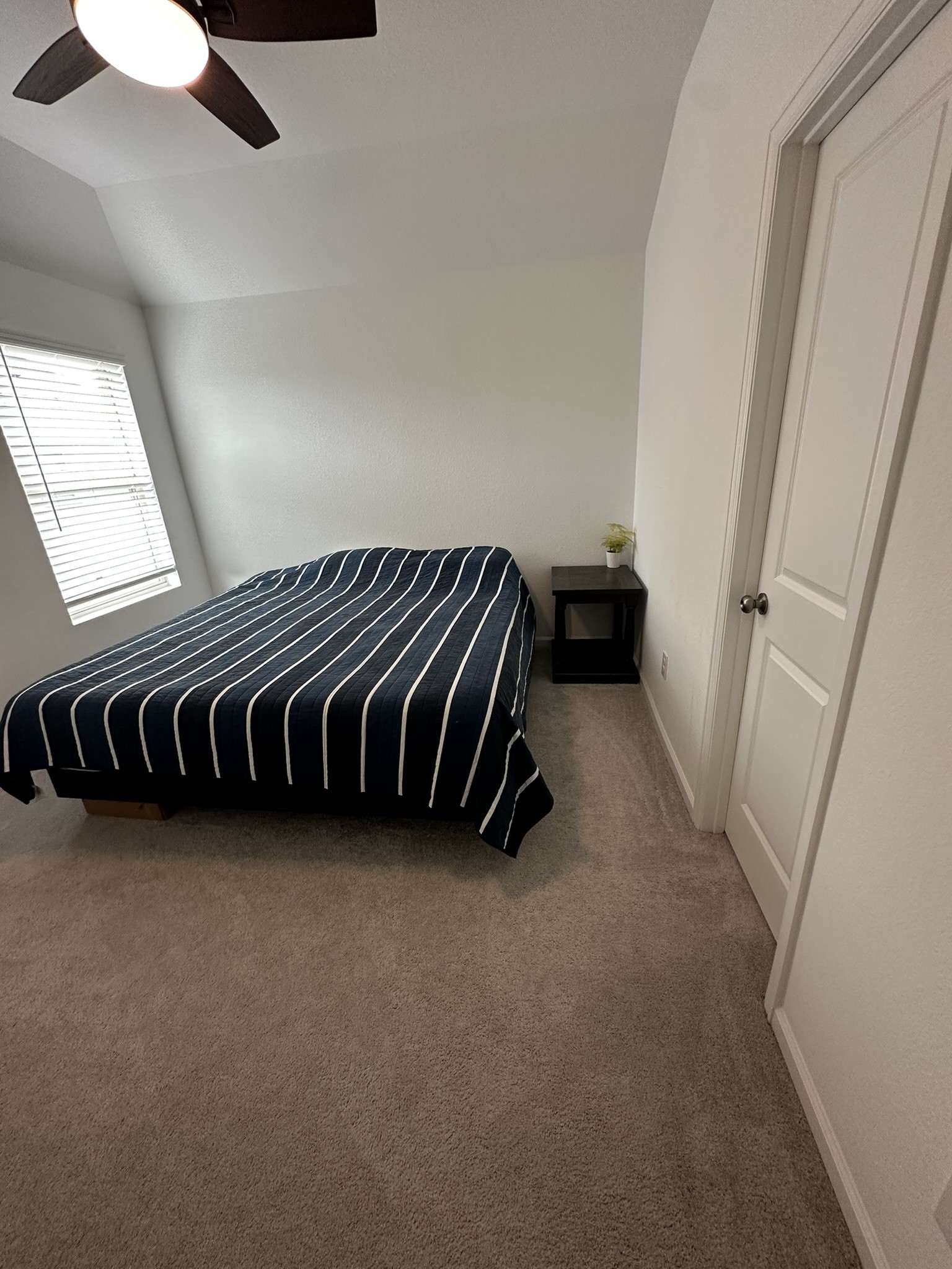 upstairs bedroom with attached bathroom