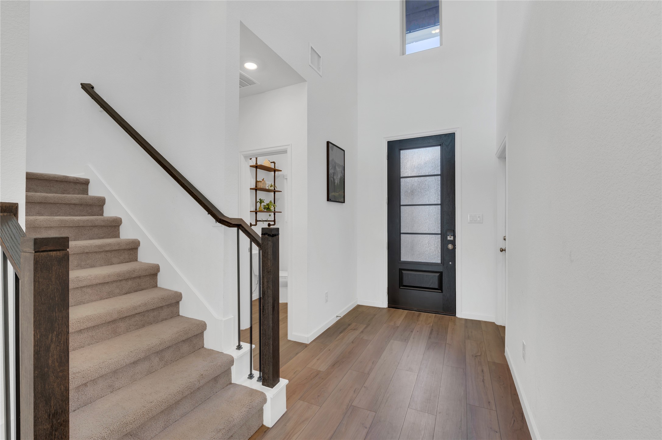half bath to the right of the door and lock off entry way to the mother-in-law suite to the left!