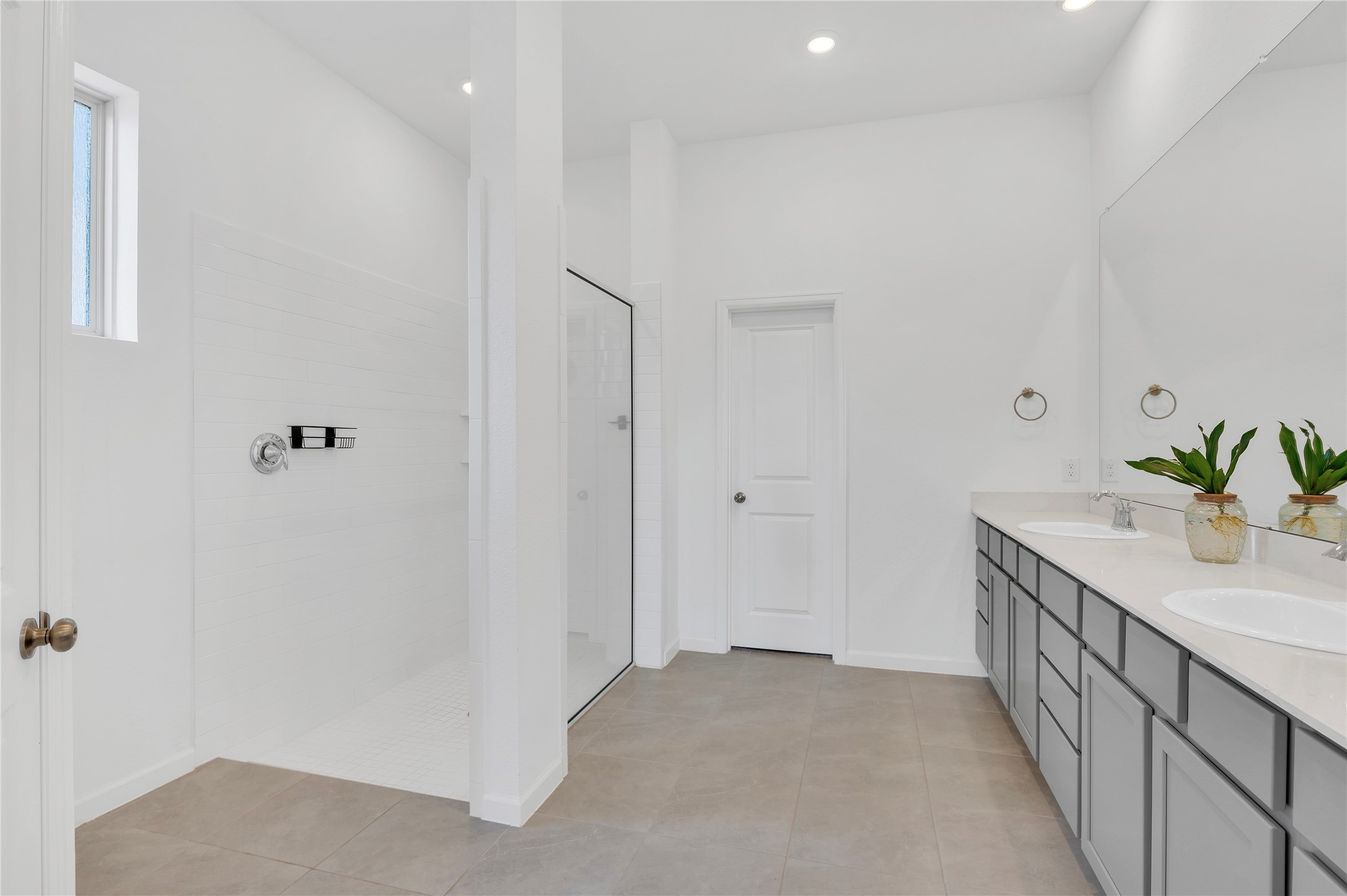 Master bath with huge shower with quartz countertops, double sinks, and plenty of counter space!