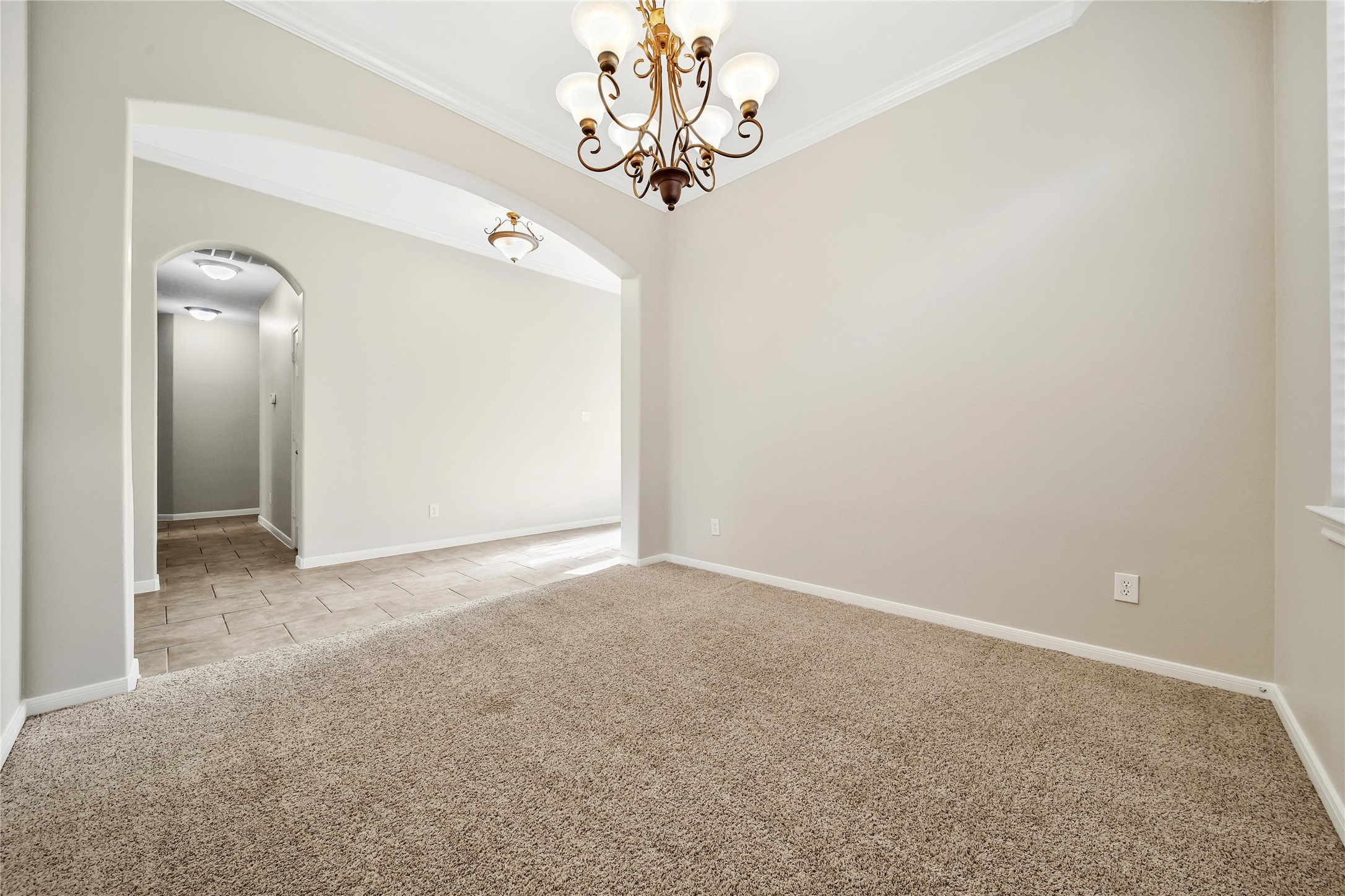This room is a dining room or additional flex space, it measures approx 11x11.