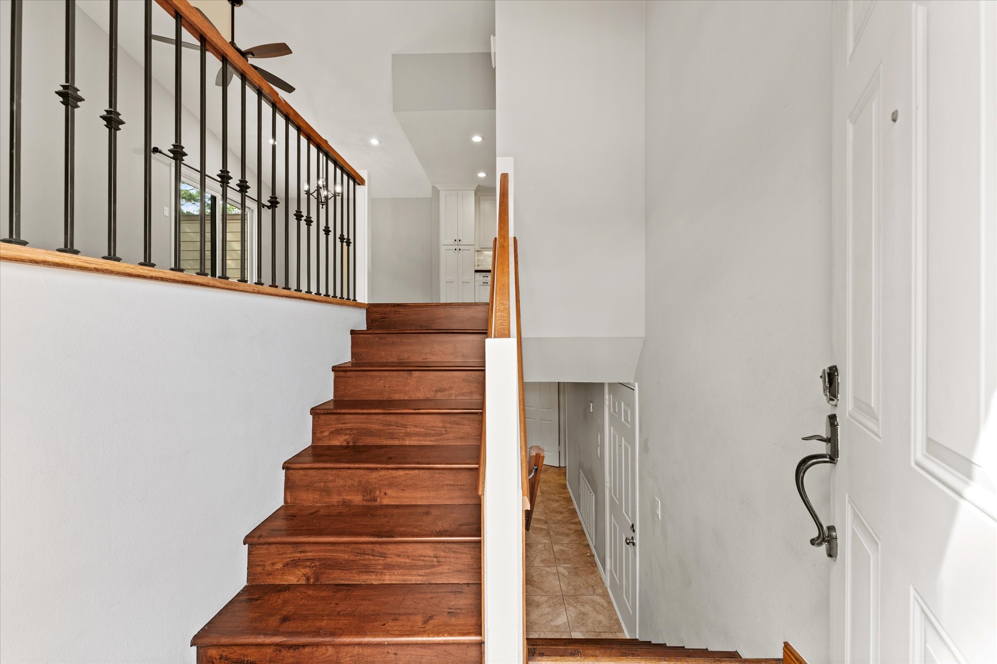 Upon entering-up to main living areas & down to bonus room