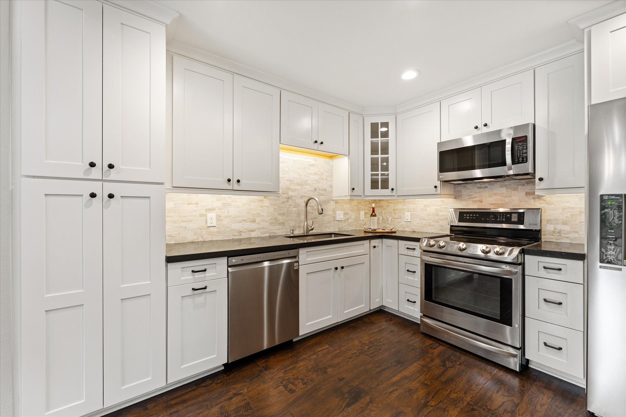 Upgrades include the tall pantry-style cabinets for extra space