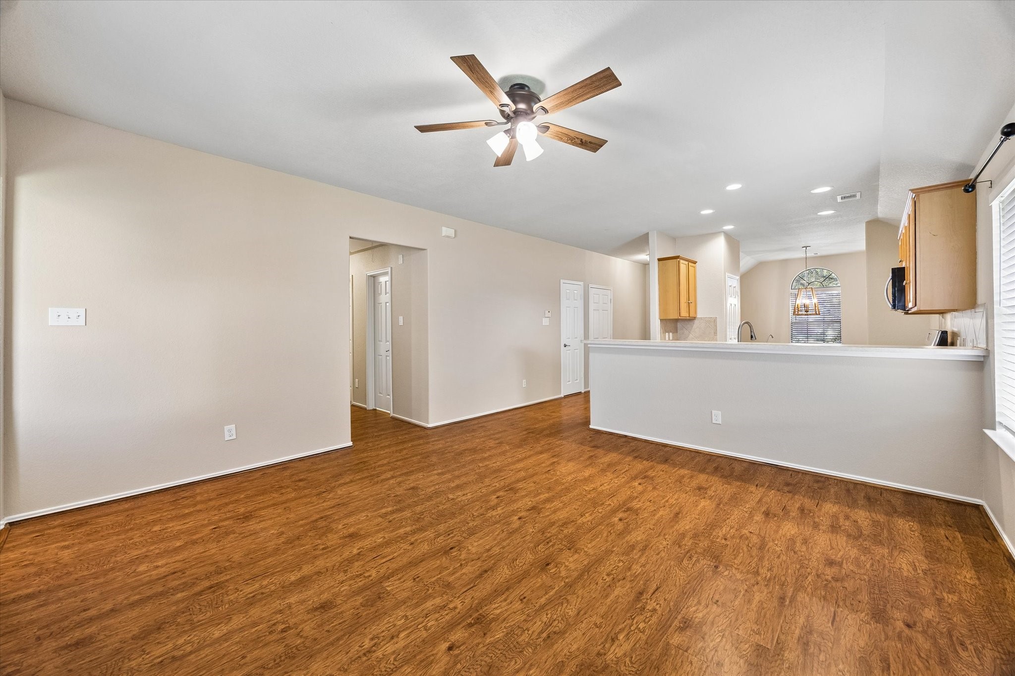 The living room opens to the kitchen, with a convenient breakfast bar that keeps everyone connected while cooking or entertaining.