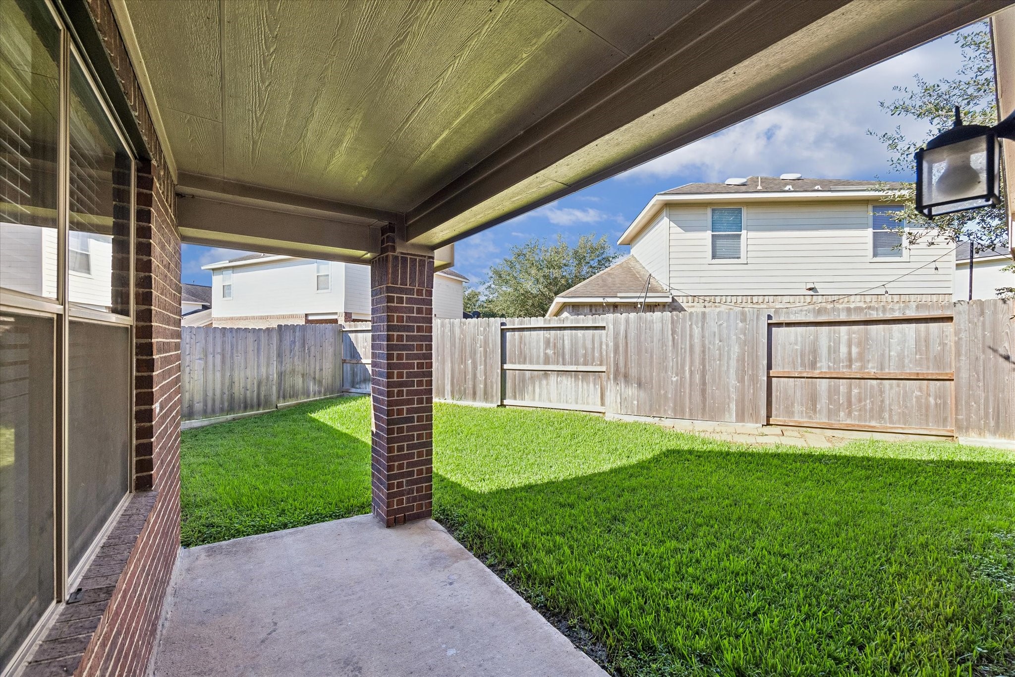 Enjoy morning coffee, outdoor dining, or relaxing evenings on the covered back patio overlooking the fenced backyard.