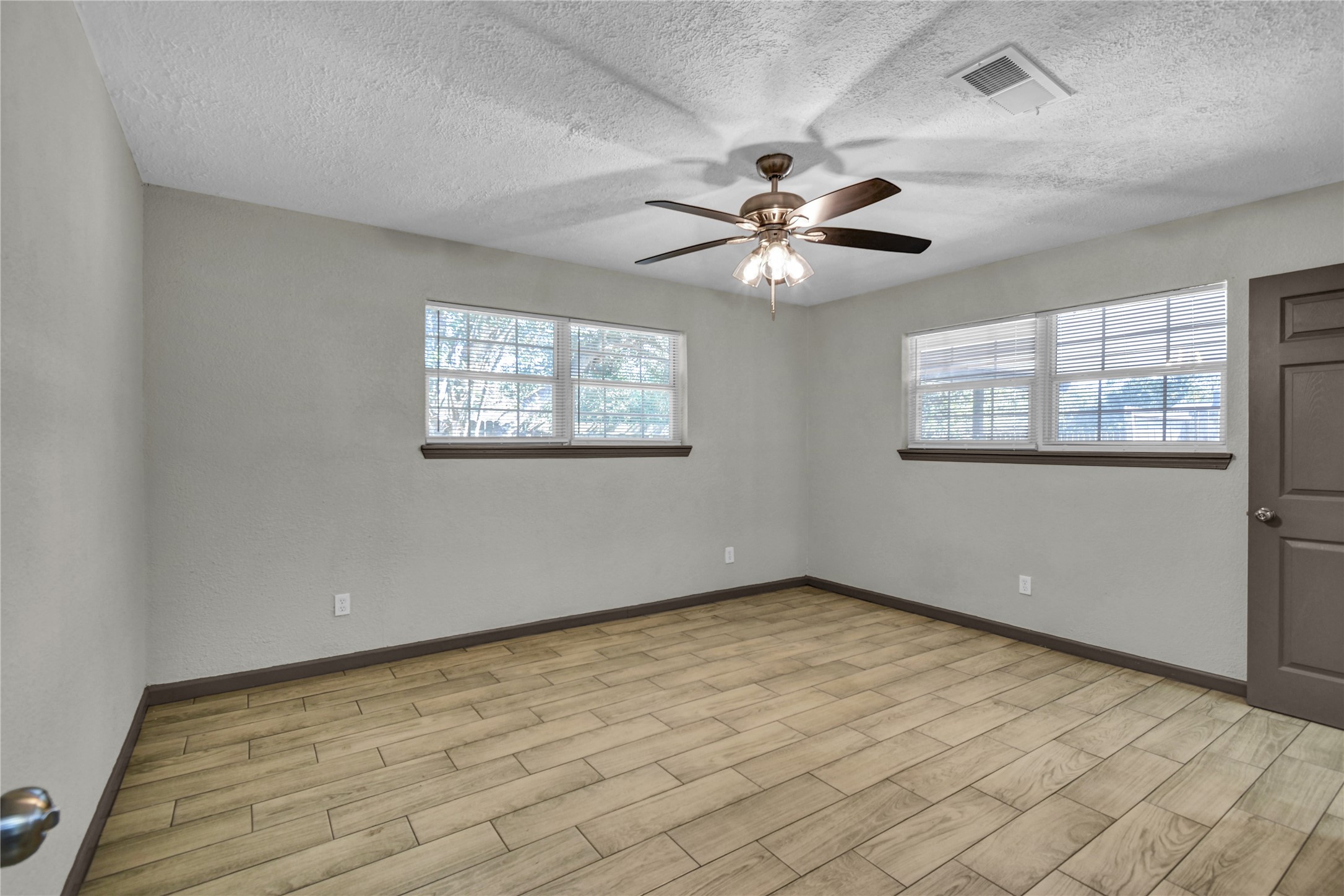 Primary bedroom with tiled flooring
