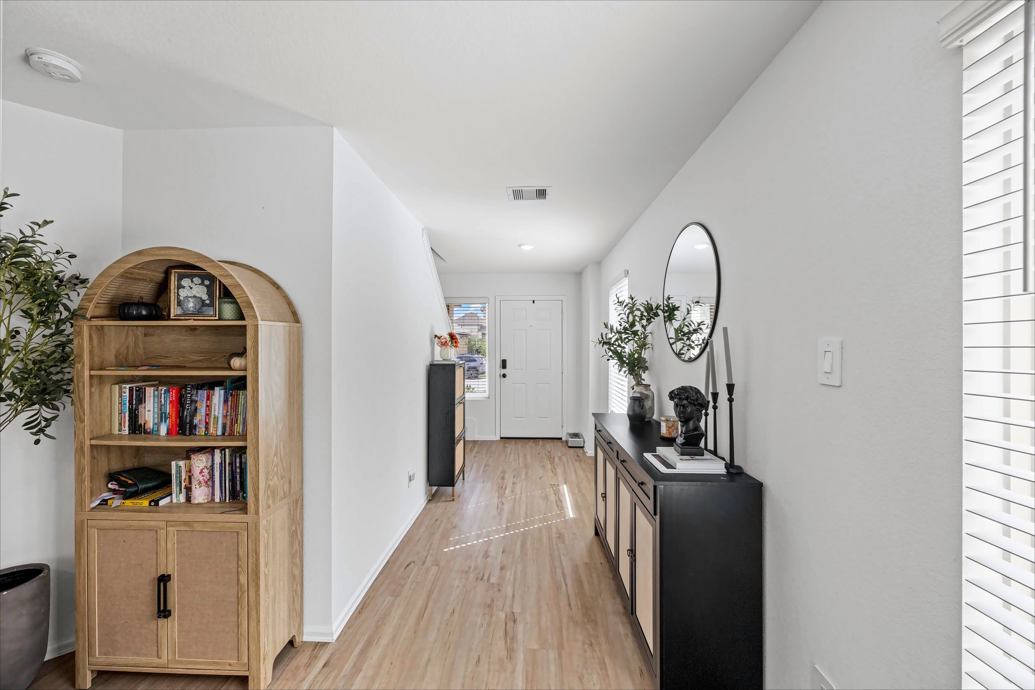 Front hallway leading into the living space with room for a drop zone