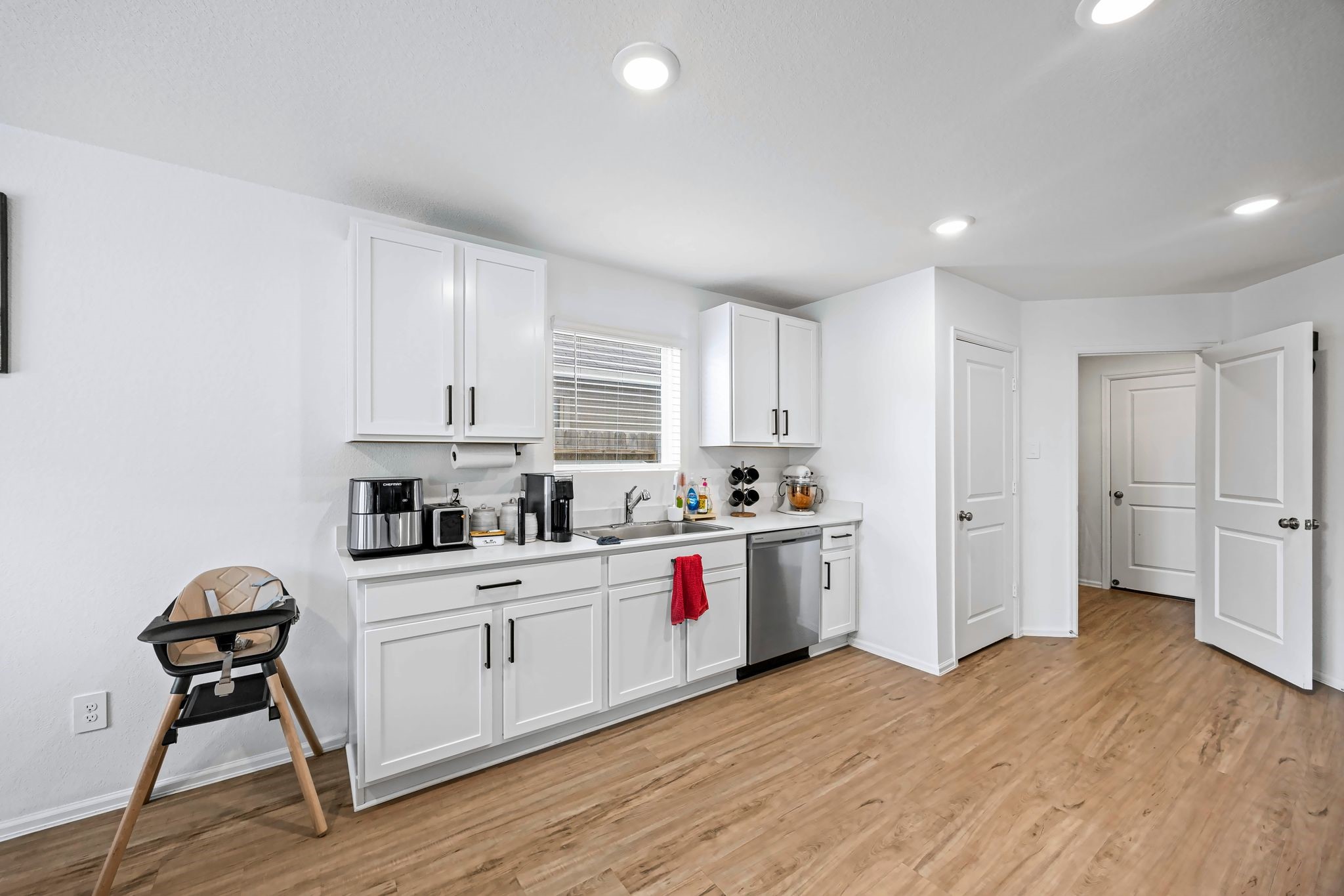 Kitchen with plenty of counter space and a window over the sink