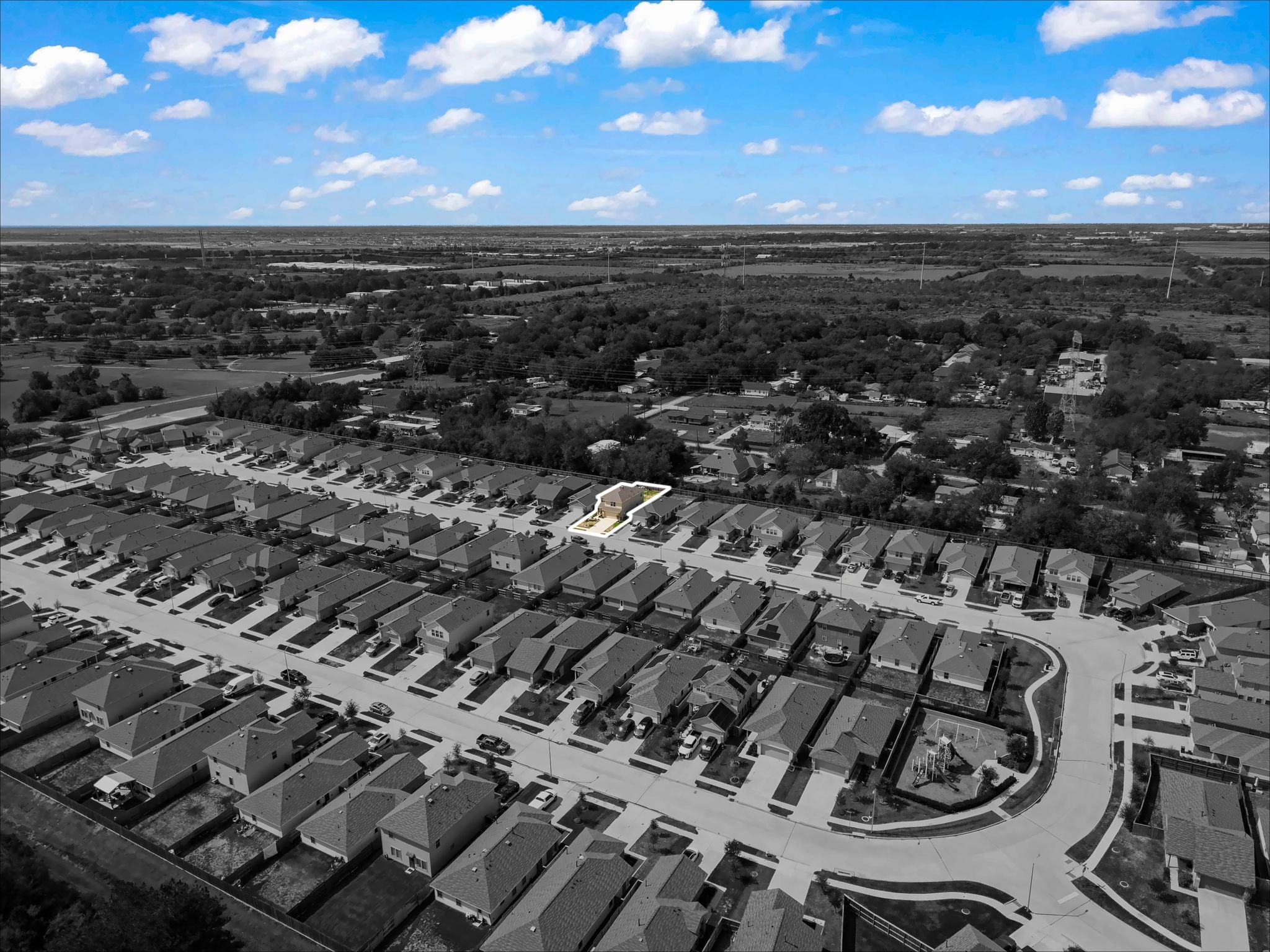 Wide aerial with the home highlighted in the neighborhood