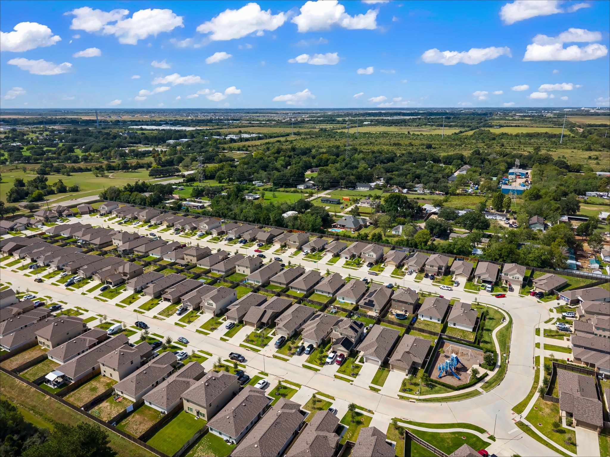 Wide aerial of the community and nearby green space
