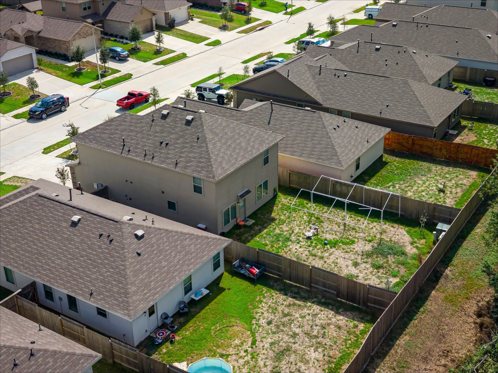 Aerial view of the backyard and rear of the home