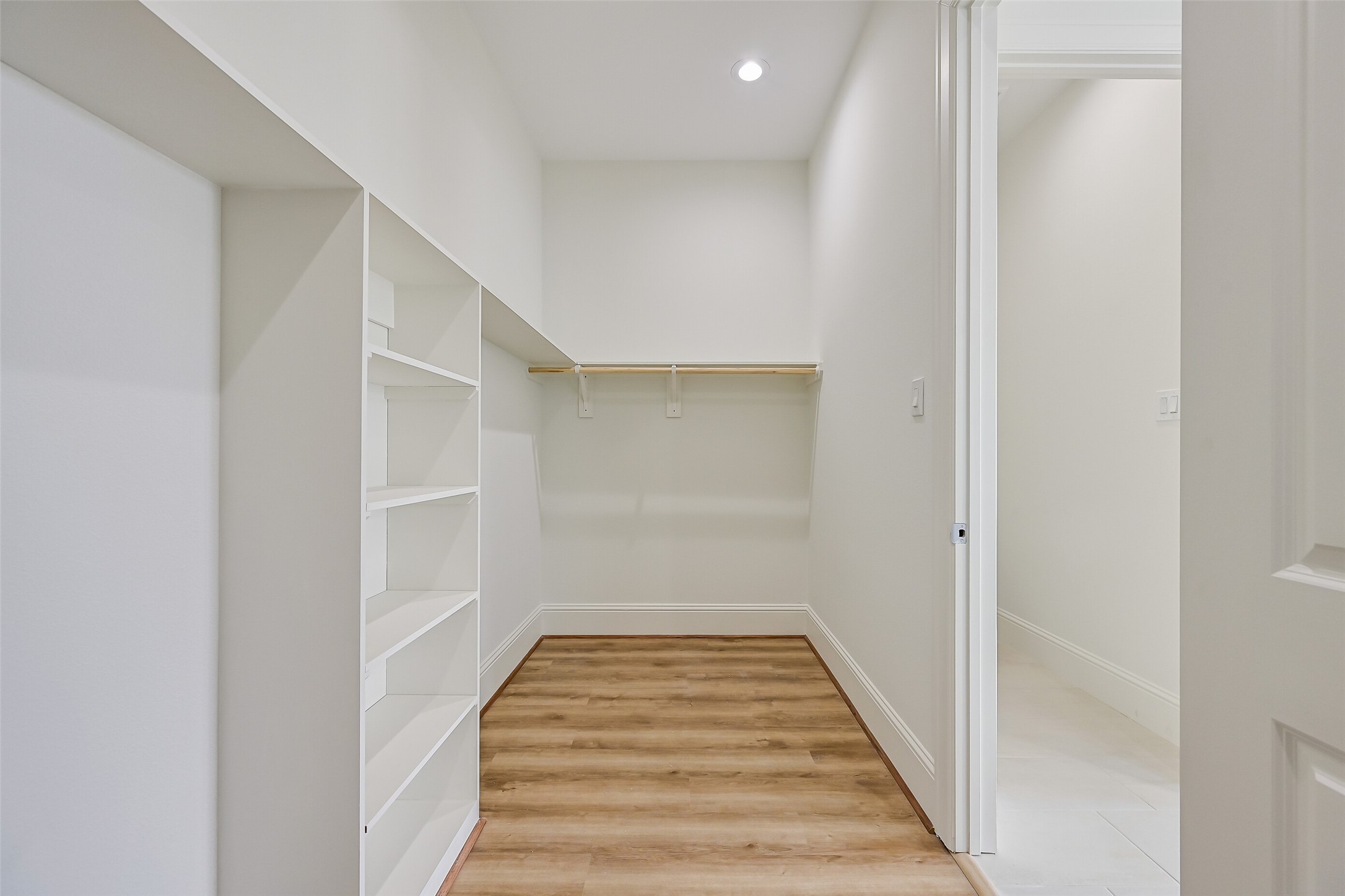 A view of the walk-in closet.