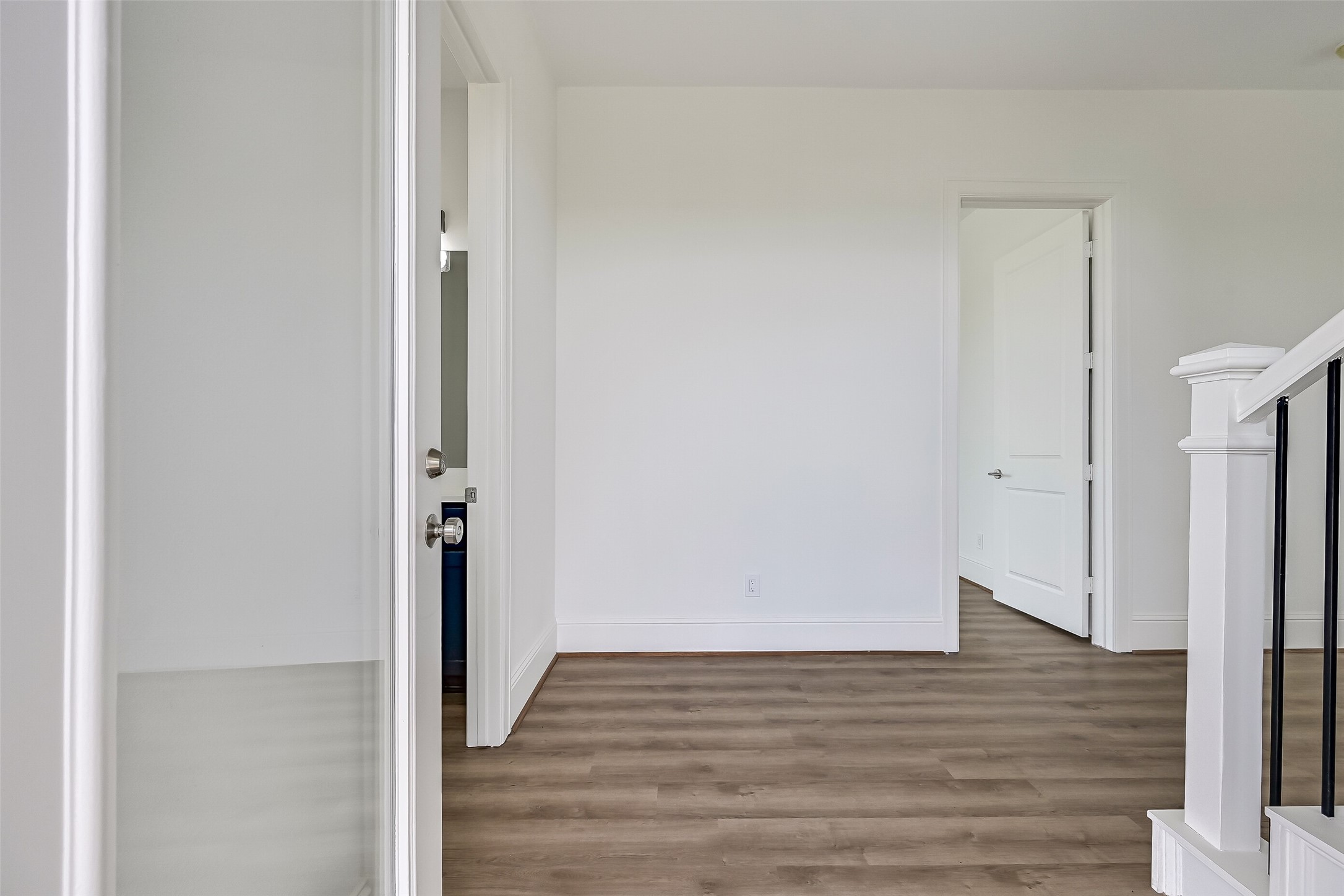 As you step inside, youll be welcomed into a spacious entryway, with a conveniently located half bathroom just through the door to your left.