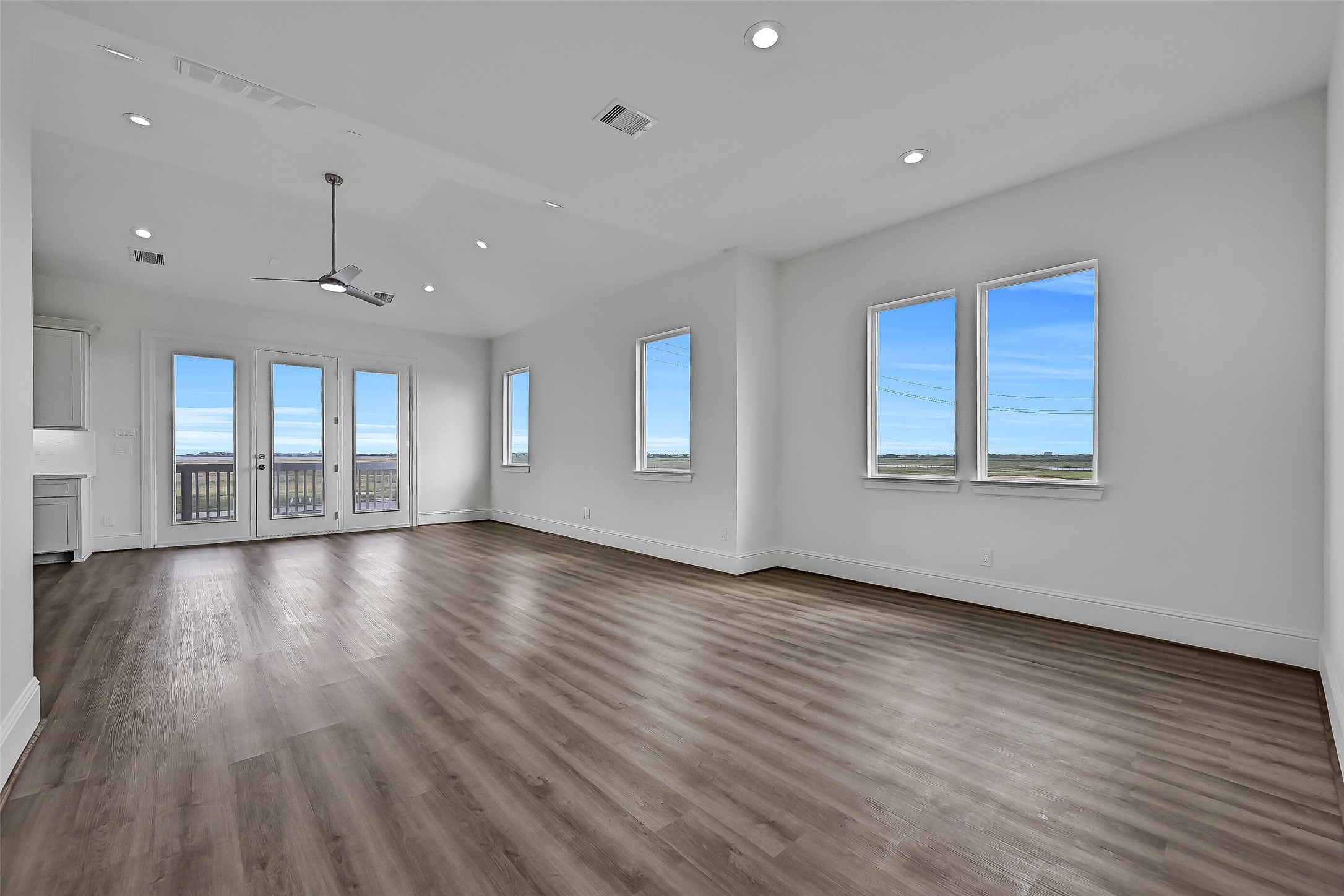 The open-concept living and dining areas offer a spacious, versatile layout with plenty of flexibility to arrange and customize the space to suit your needs.