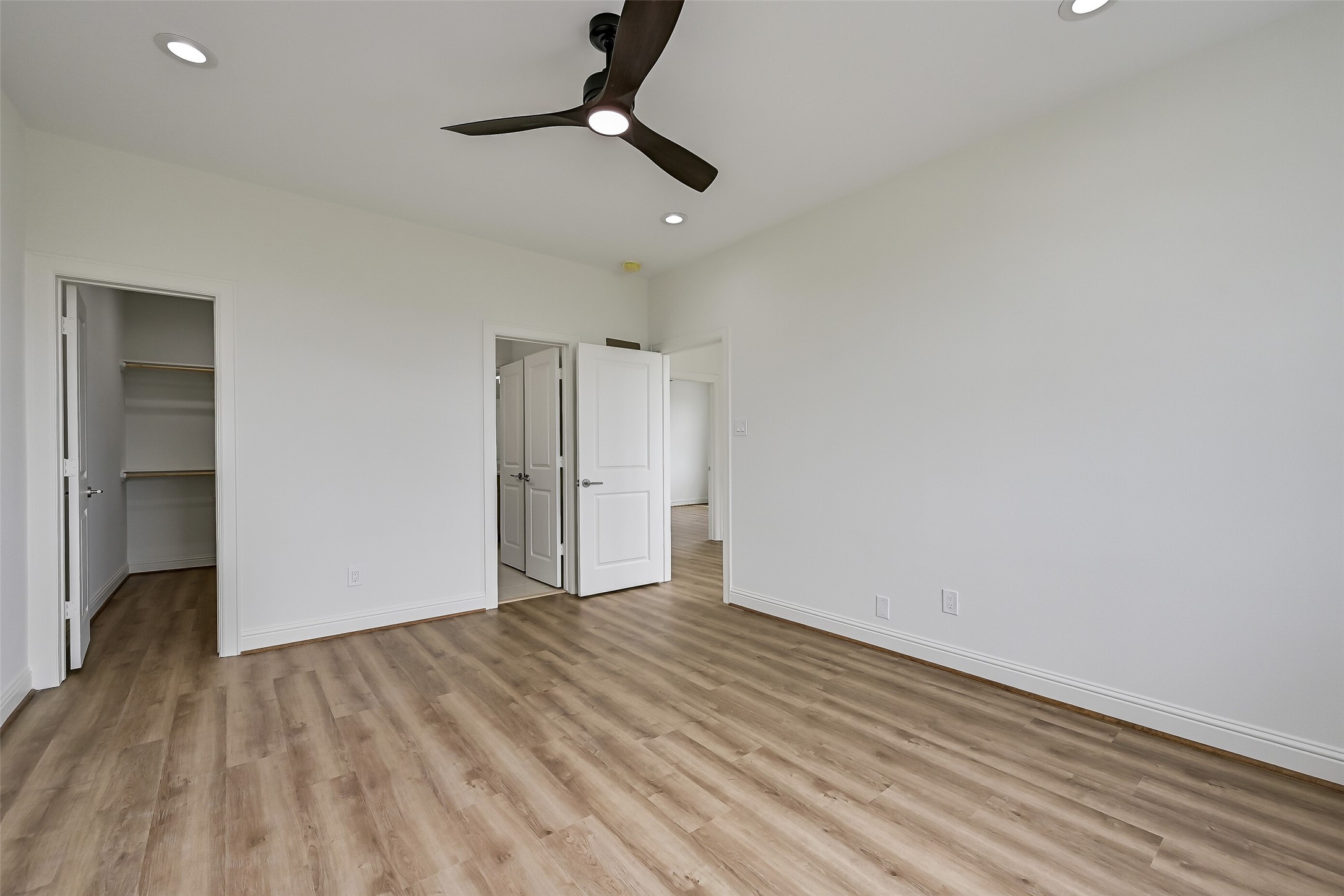 The guest bedroom features a spacious closet and convenient access to a Jack-and-Jill bathroom shared with the second upstairs bedroom.
