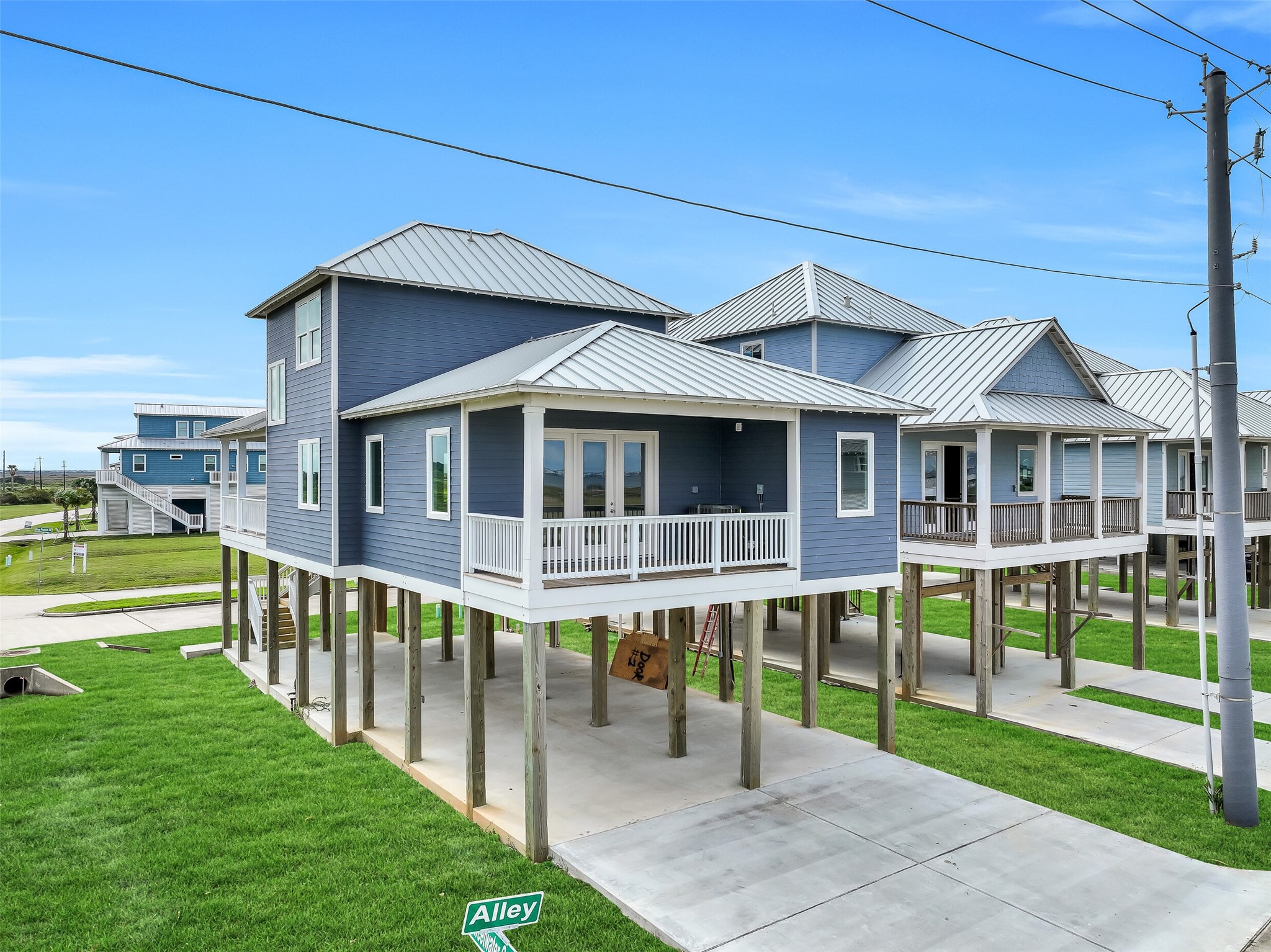 The double-wide driveway and additional carport provide ample parking space for multiple vehicles and guests.