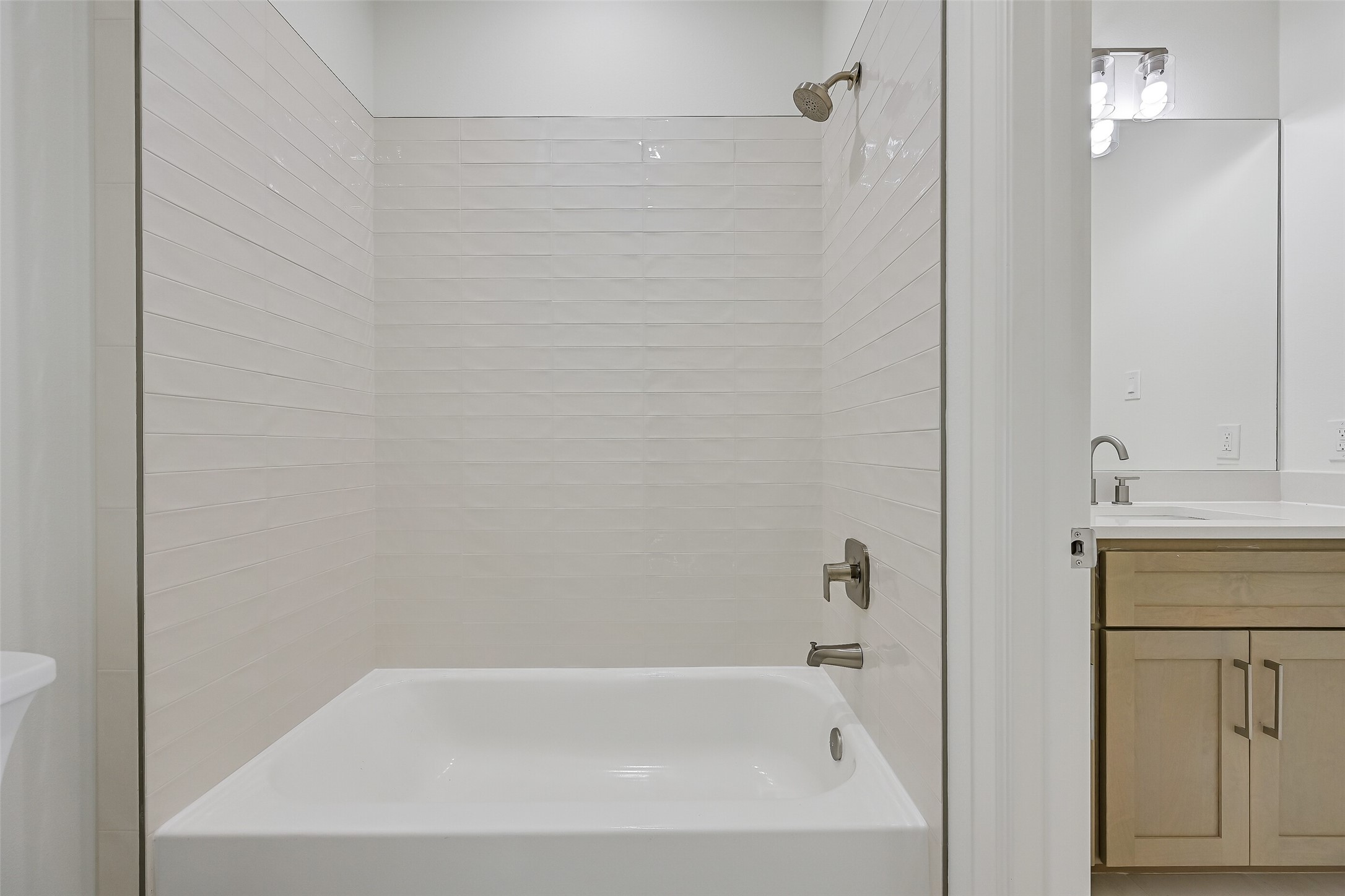 The bathroom offers a tub/shower combo.
