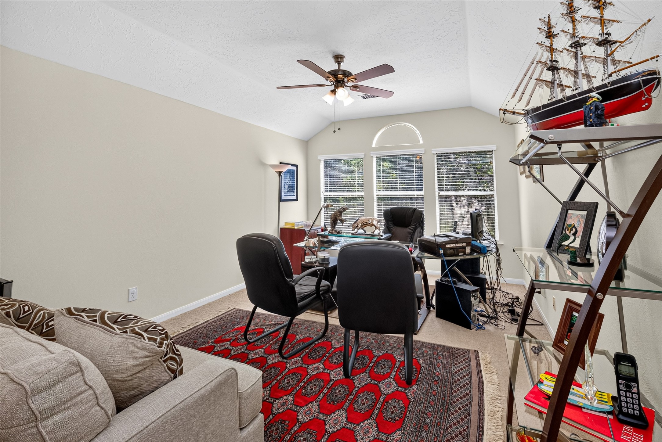 This is the primary bedroom that is currently being used as an office.
