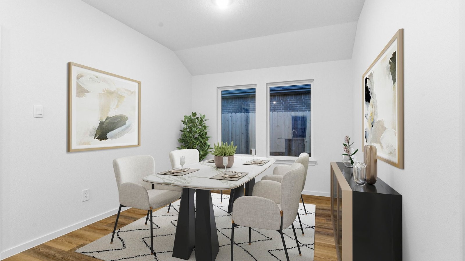 Formal dining area with large windows, vinyl wood floors, and view of the backyard.