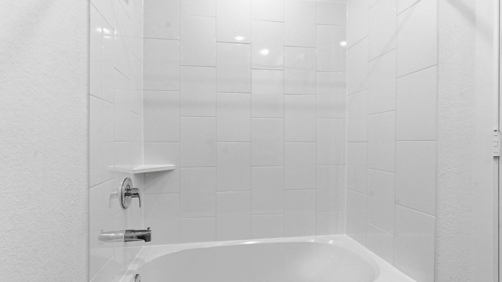 Standing shower in the secondary bathroom