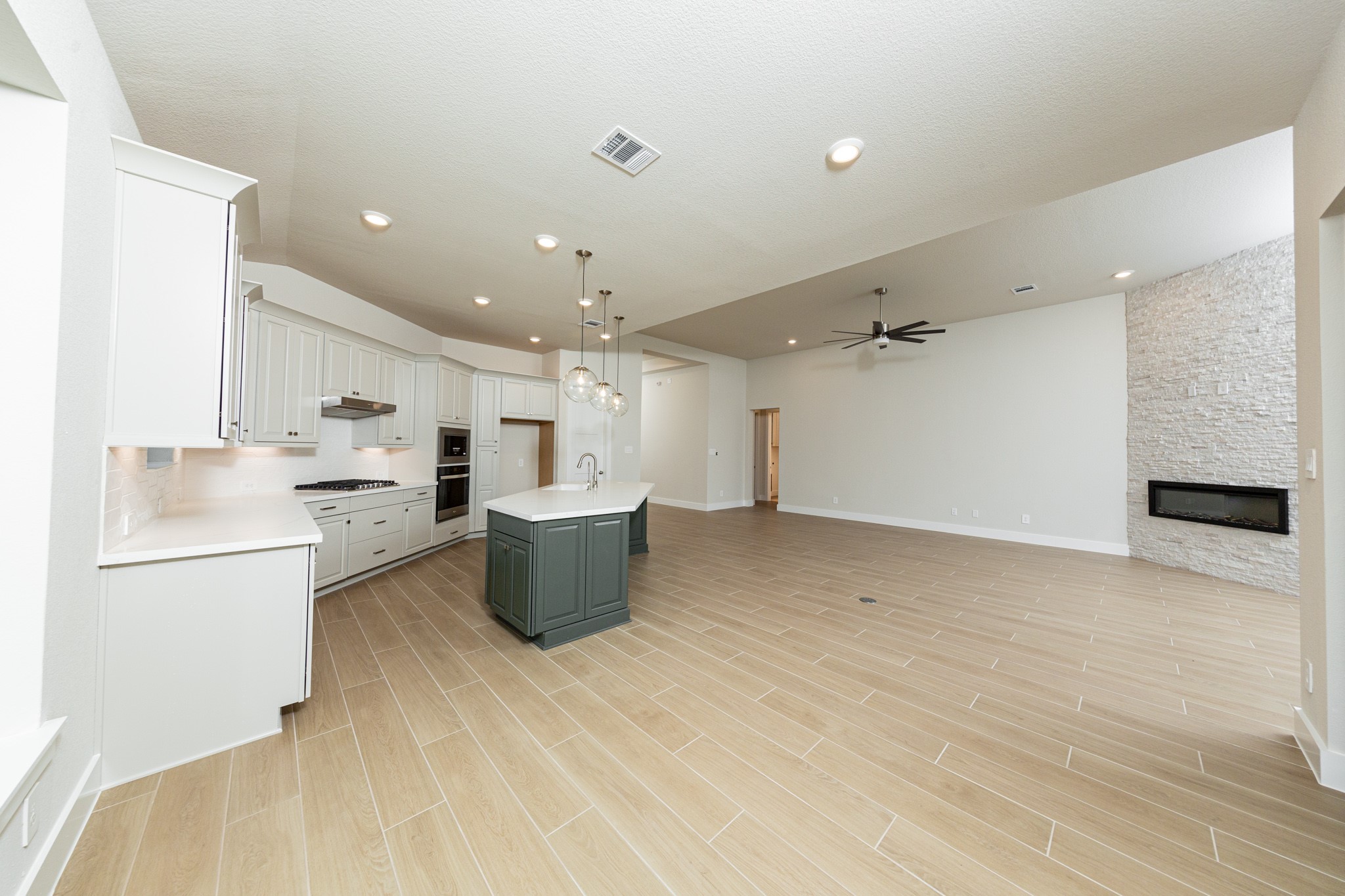Stunning open-concept design seamlessly connecting the living, dining, and kitchen areasperfect for both everyday living and entertaining!