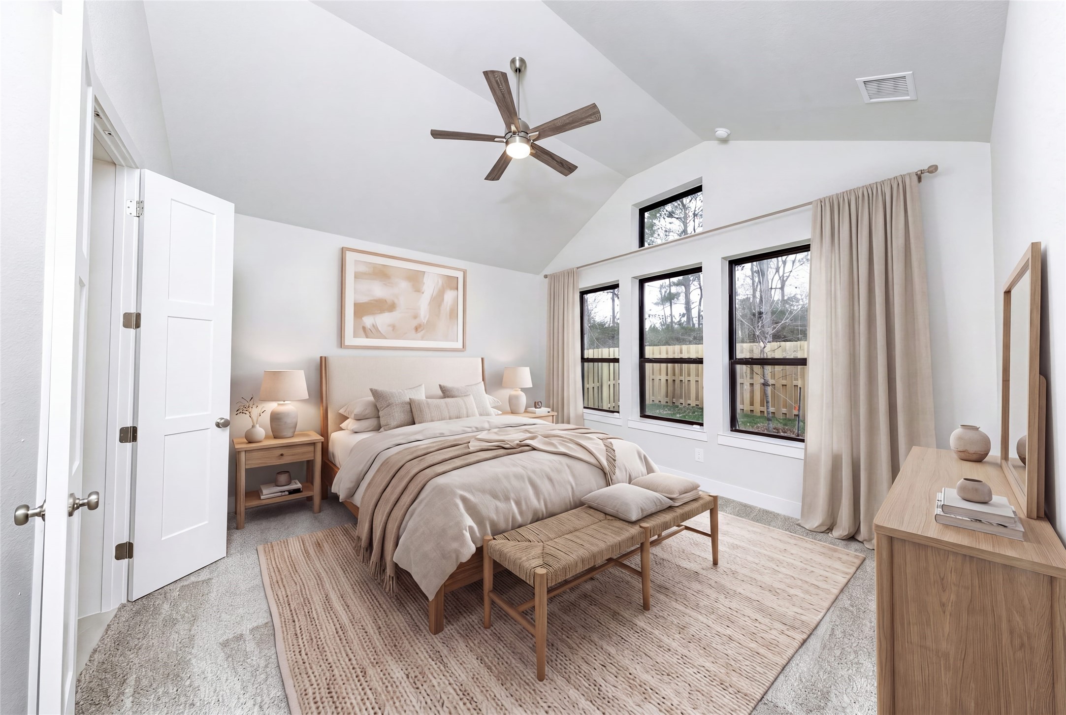 Relax and unwind after a long day in this impressive primary suite! This generously sized room offers plush carpeting, neutral-toned paint, high ceilings with a ceiling fan, and large windows for added comfort and tranquility. *Virtually Staged