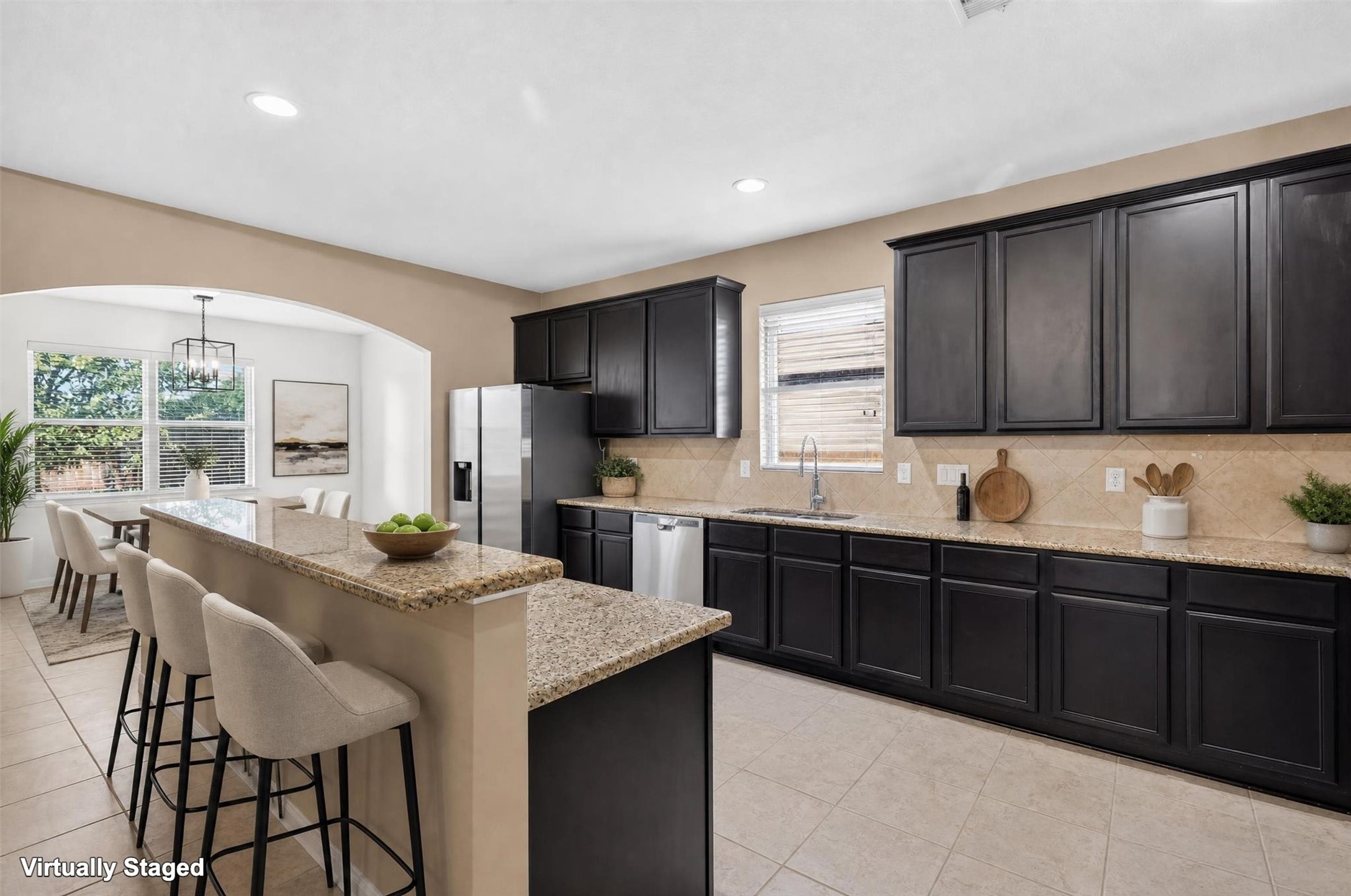 Natural light and inviting finishes make this kitchen a welcoming hub of the home! A window above the sink brightens the workspace