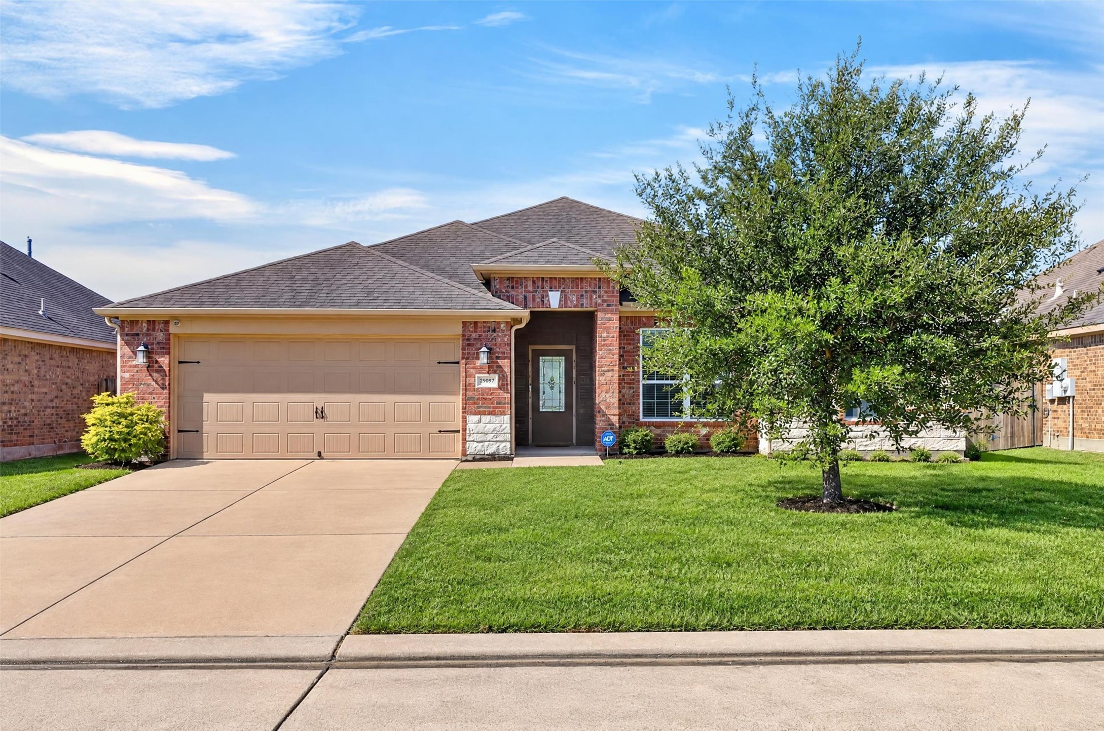 The home's brick exterior and established landscaping add character, while the single-story design keeps everyday living on one level.