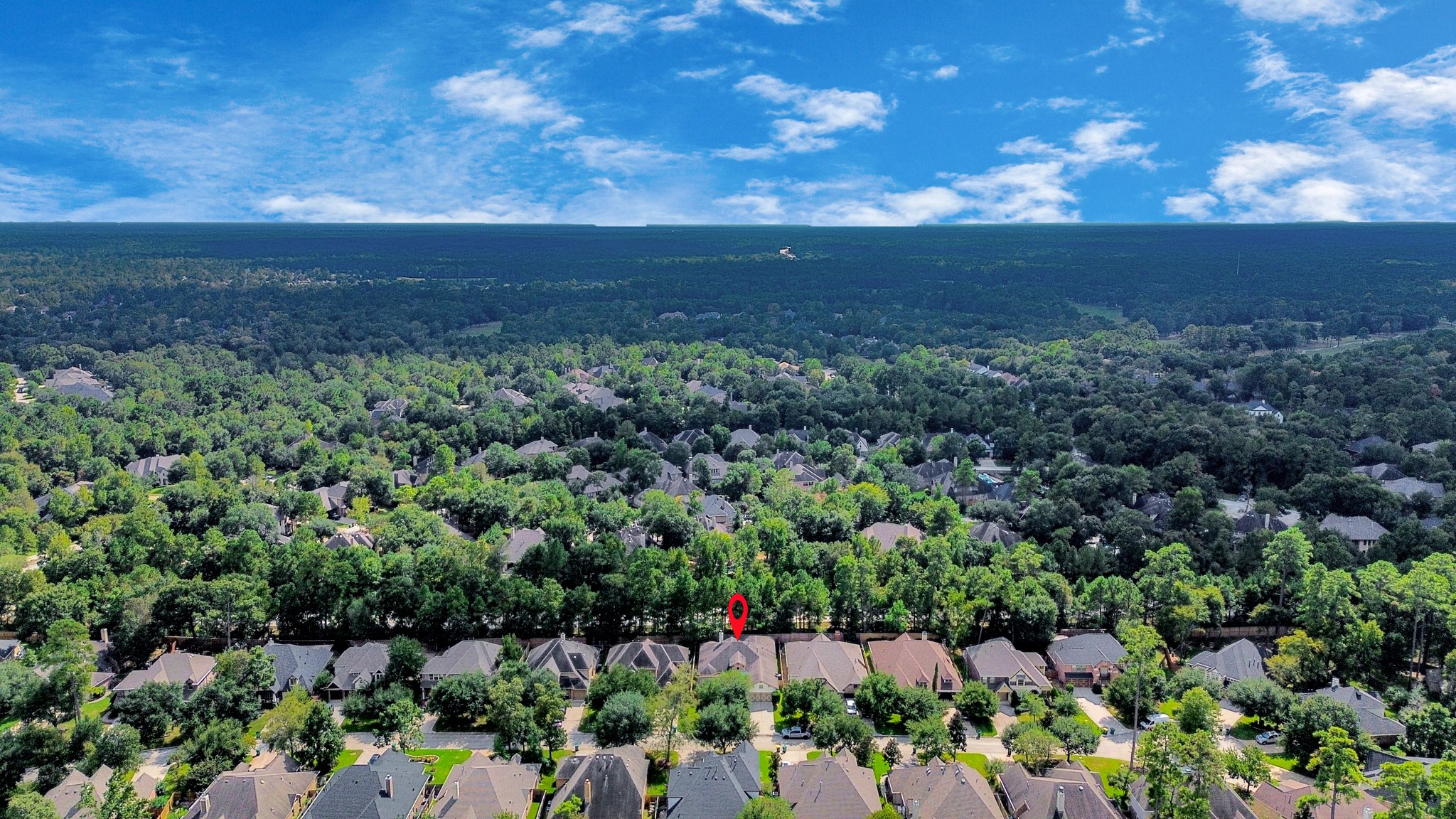 Nestled in a lush, forested neighborhood, this home offers serene surroundings and a sense of privacy, with easy access to nearby amenities.