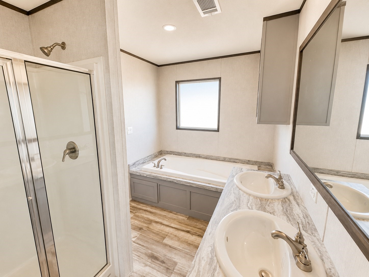 Indulge in comfort and relaxation in this beautiful primary bathroom! Featuring a spacious walk-in shower, stylish vanity with ample countertop space, modern fixtures, and elegant finishes, this bathroom offers the perfect blend of style and functionality. The bright, inviting atmosphere creates a refreshing retreat where you can start and end your day in comfort!