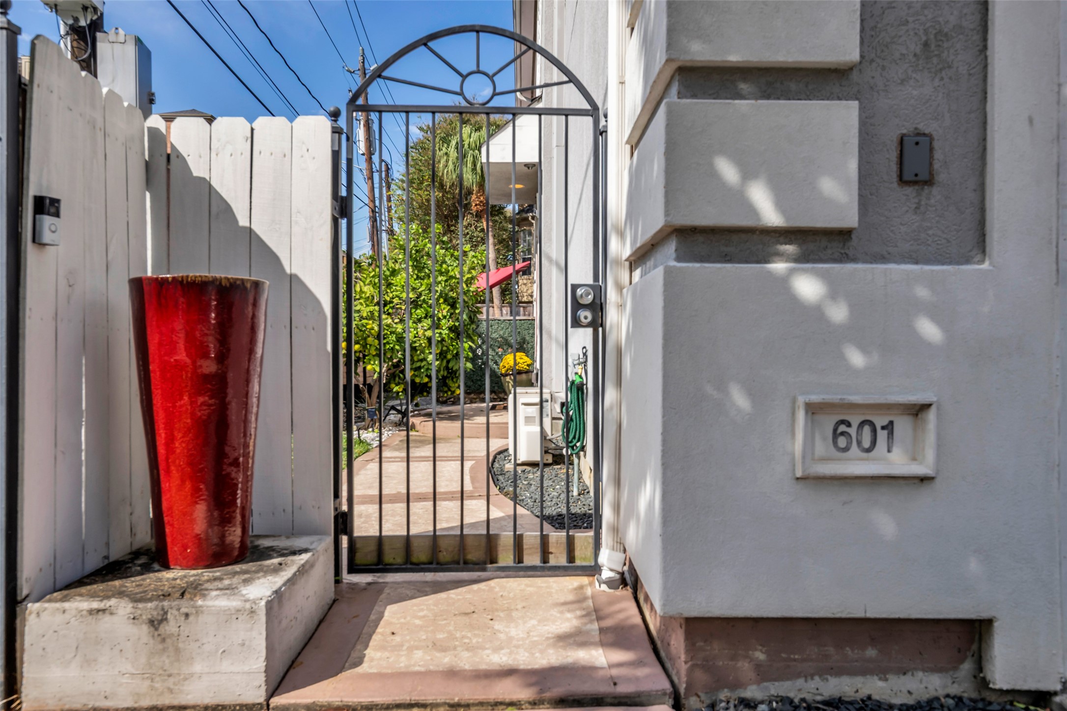 Private gated entry leading to the front door. Yard maintenance is included in the lease.