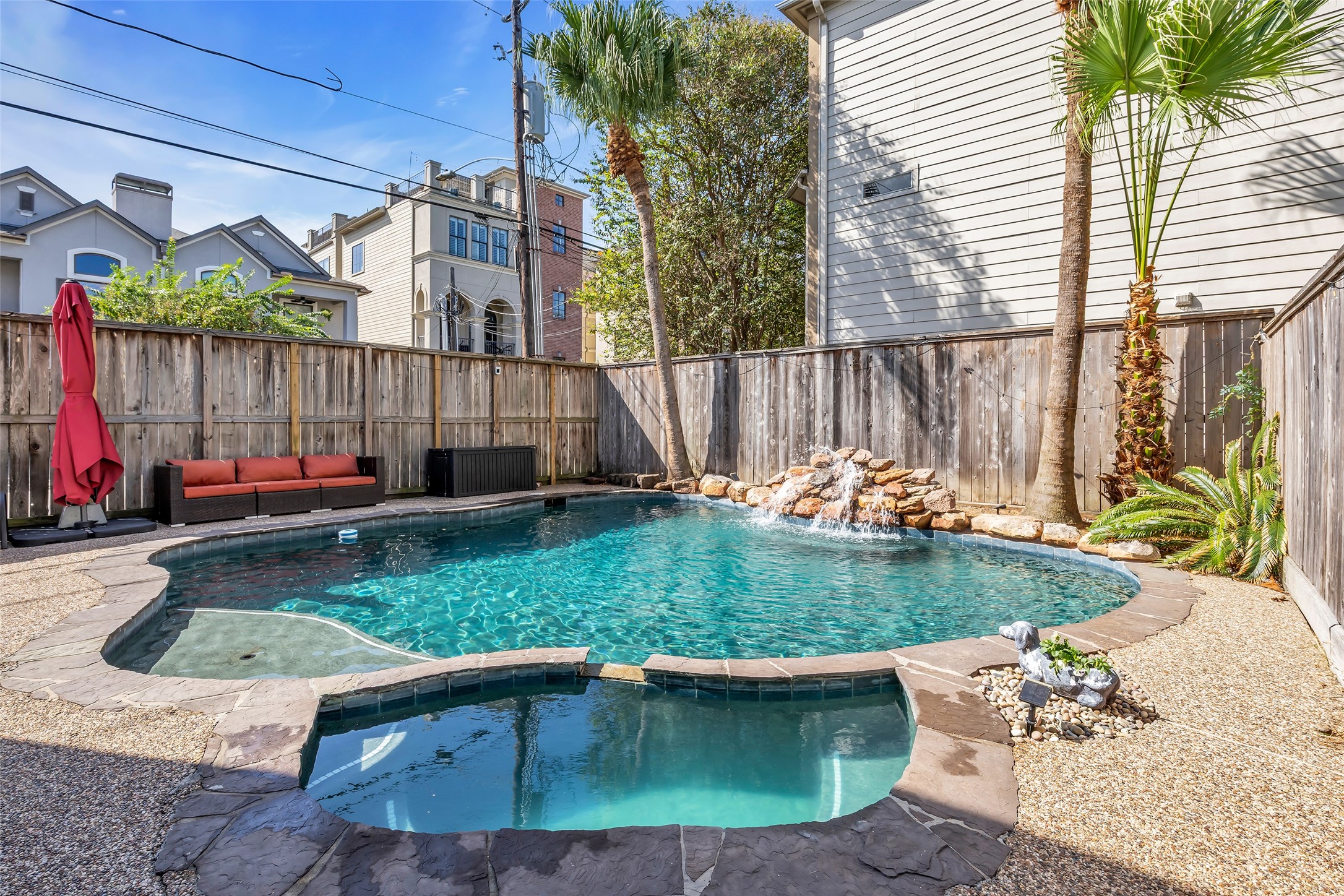 Heated pool and spa with waterfall feature.