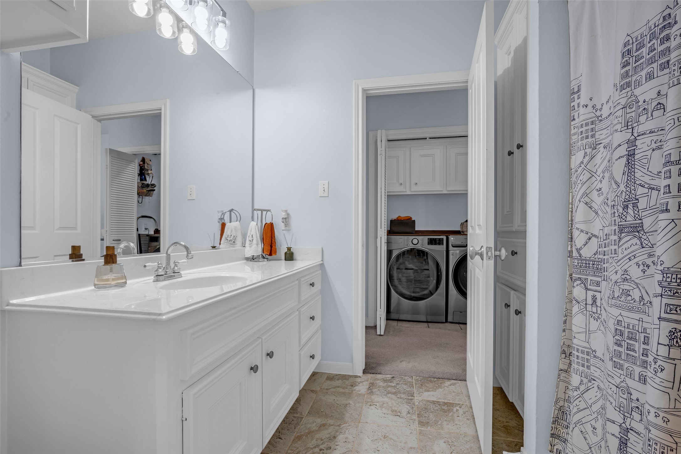 Bathroom with shower over the tub.