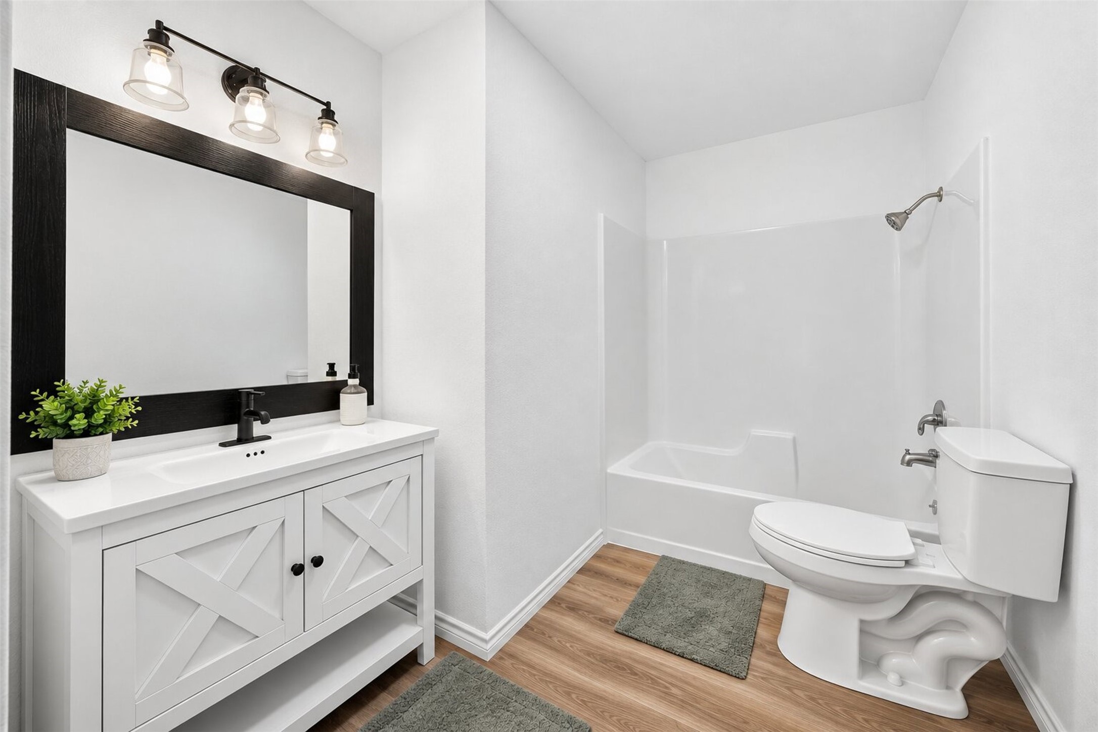 New vanity and fixture, new toilet and new flooring.