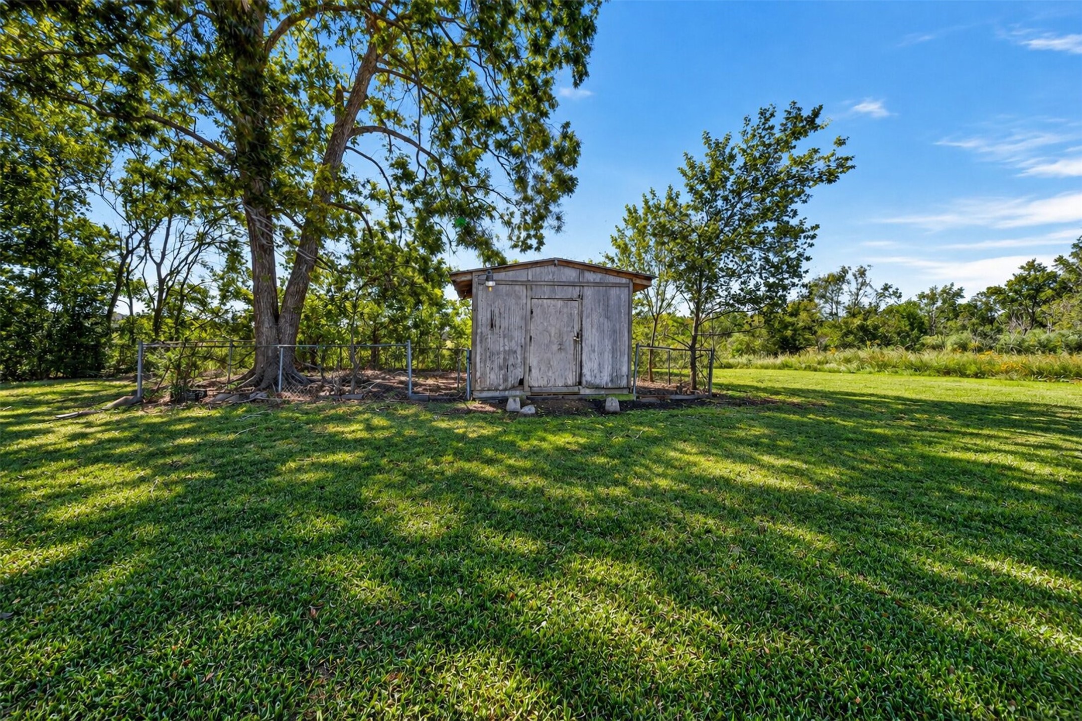 Storage shed and large producing pecan tree. Photos are enhanced to show full potential. Storage shed and large producing pecan tree. Photos are enhanced to show full potential.