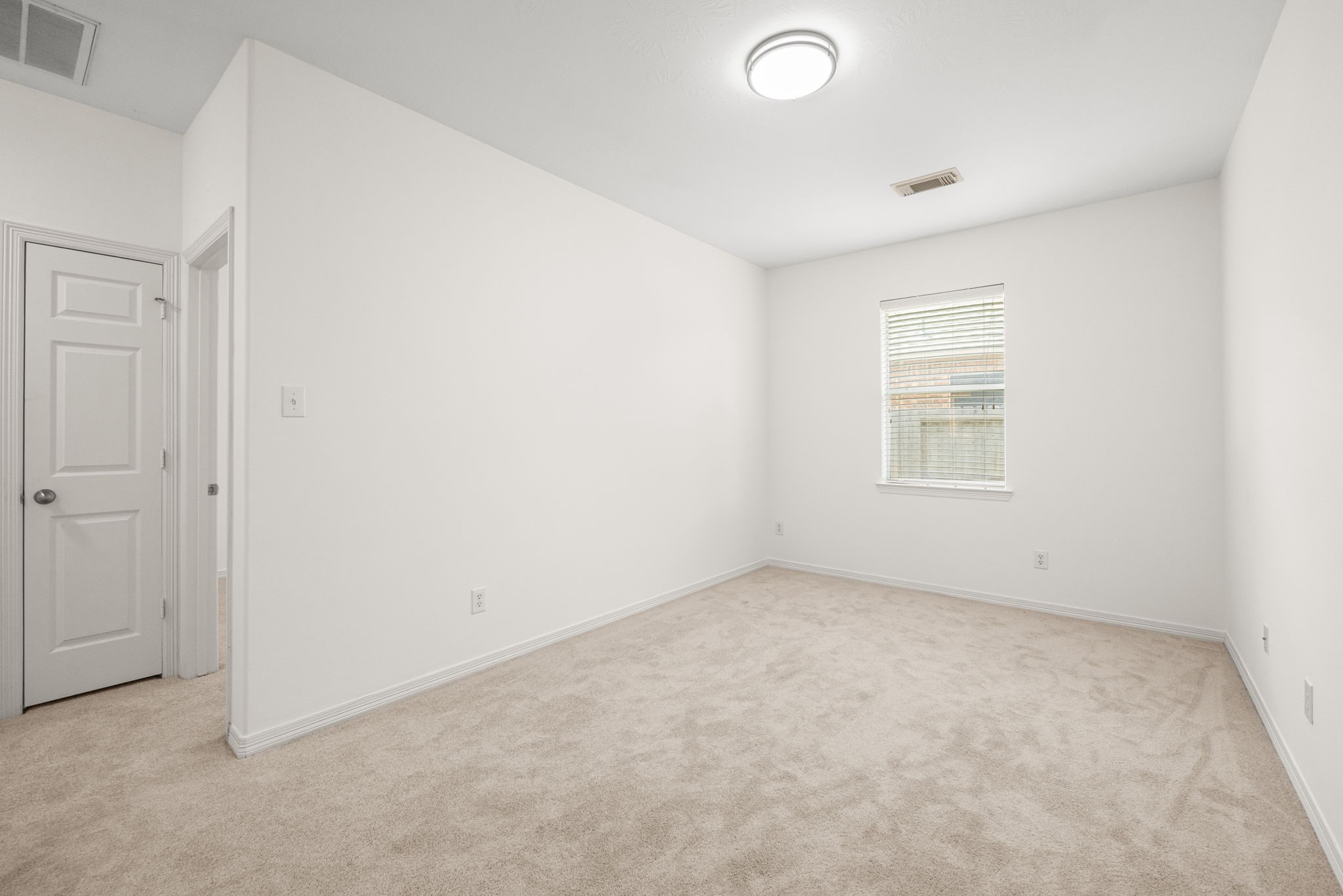 Located between the secondary bedrooms, this versatile space offers options beyond a traditional bedroom layout, from a quiet reading corner to a compact media lounge or hobby space.